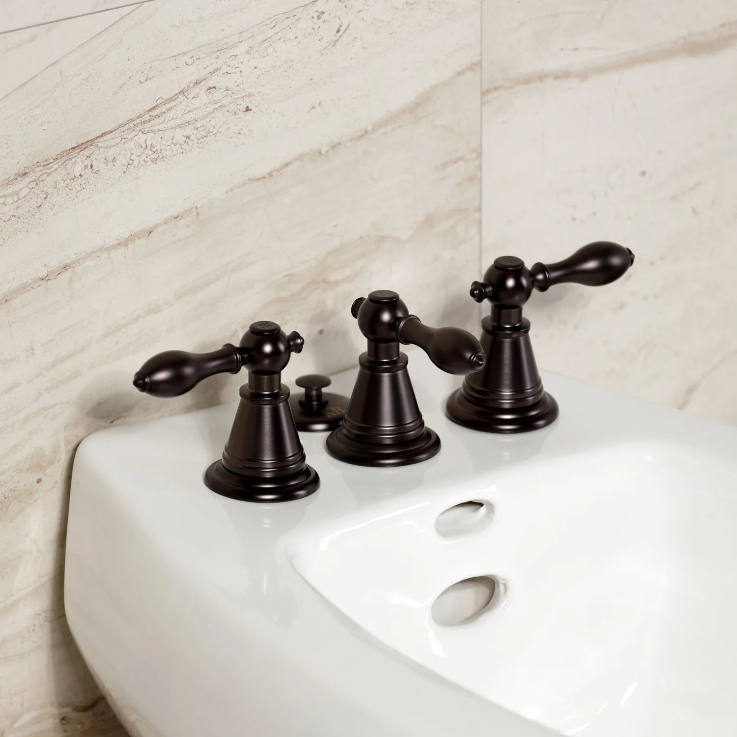 Oil-rubbed bronze three-handle bidet faucet set on a white sink top