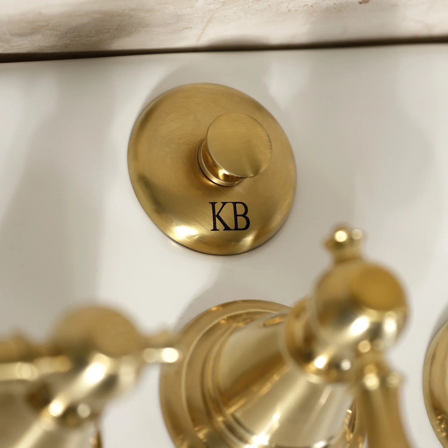 Brushed brass handle cover with KB logo for Victorian bidet faucet