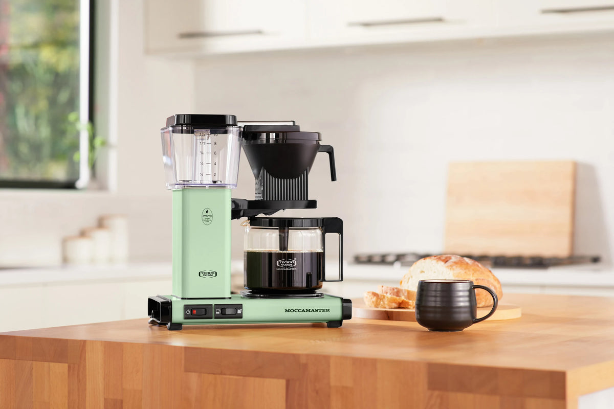 Pistachio Moccamaster coffee maker with glass carafe and black brew unit