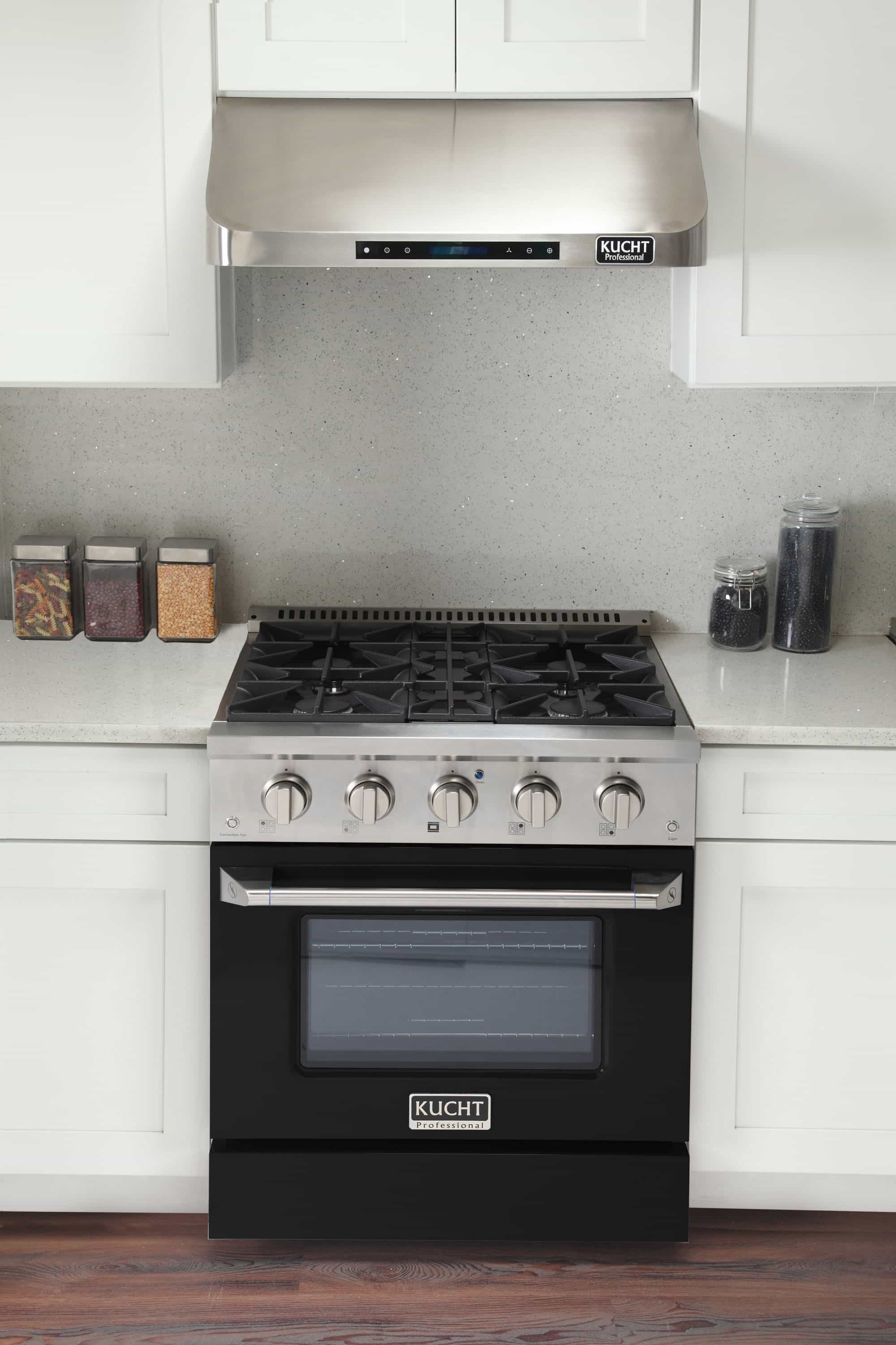 Stainless steel dual fuel range with open black oven door and gas cooktop burners