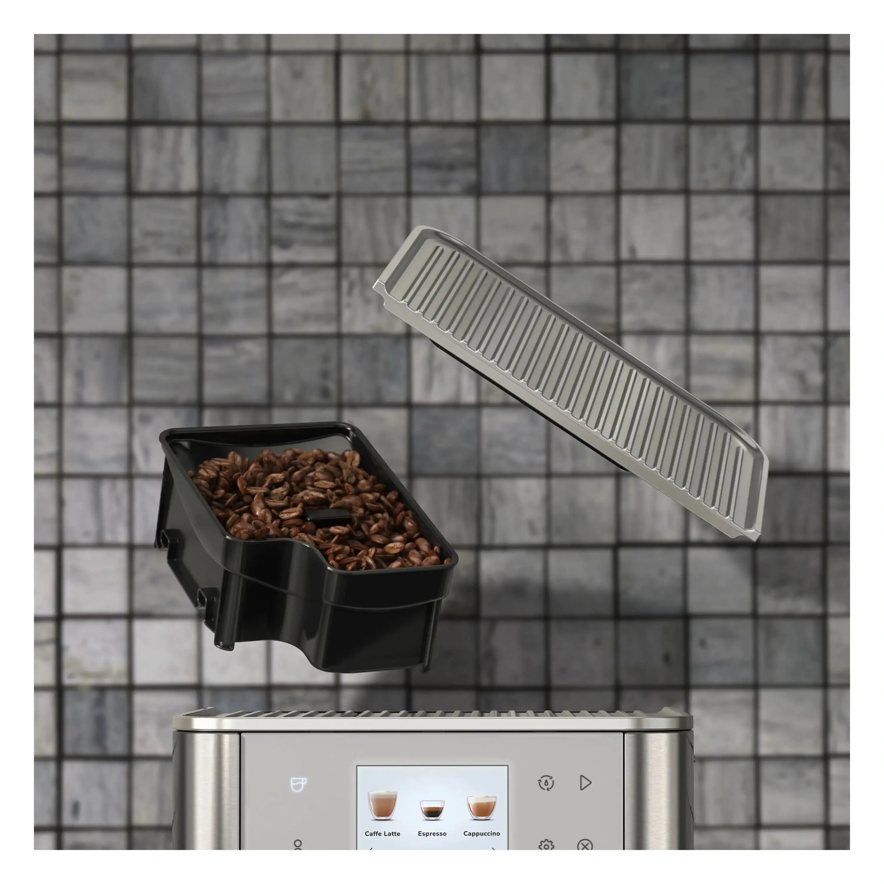 Espresso machine top with black coffee bean hopper and gray cleaning tool