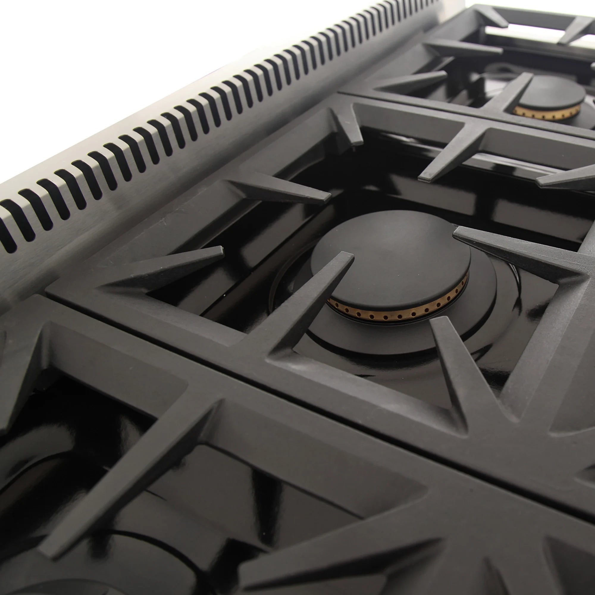 Close-up of gas burner grates and round burner caps on gray cooktop