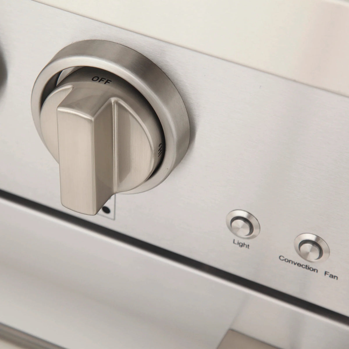 Stainless steel control panel with black selector knob and indicator labels