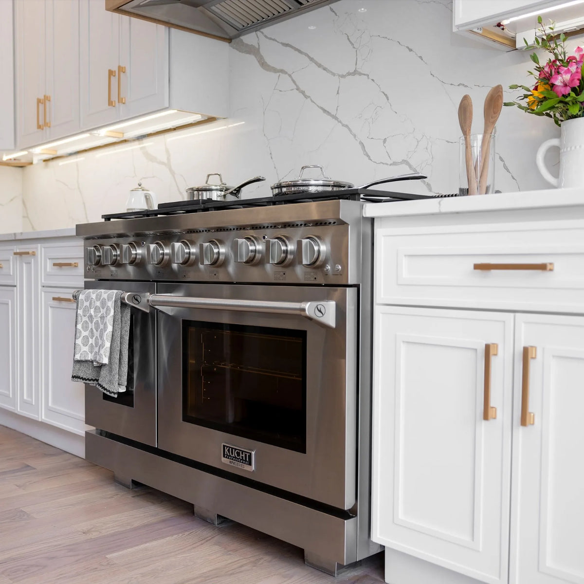 Stainless steel gas range with six burners and dual ovens