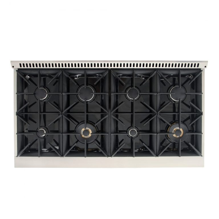 Open cooktop view of sealed burners inside a natural gas range with cast grates.