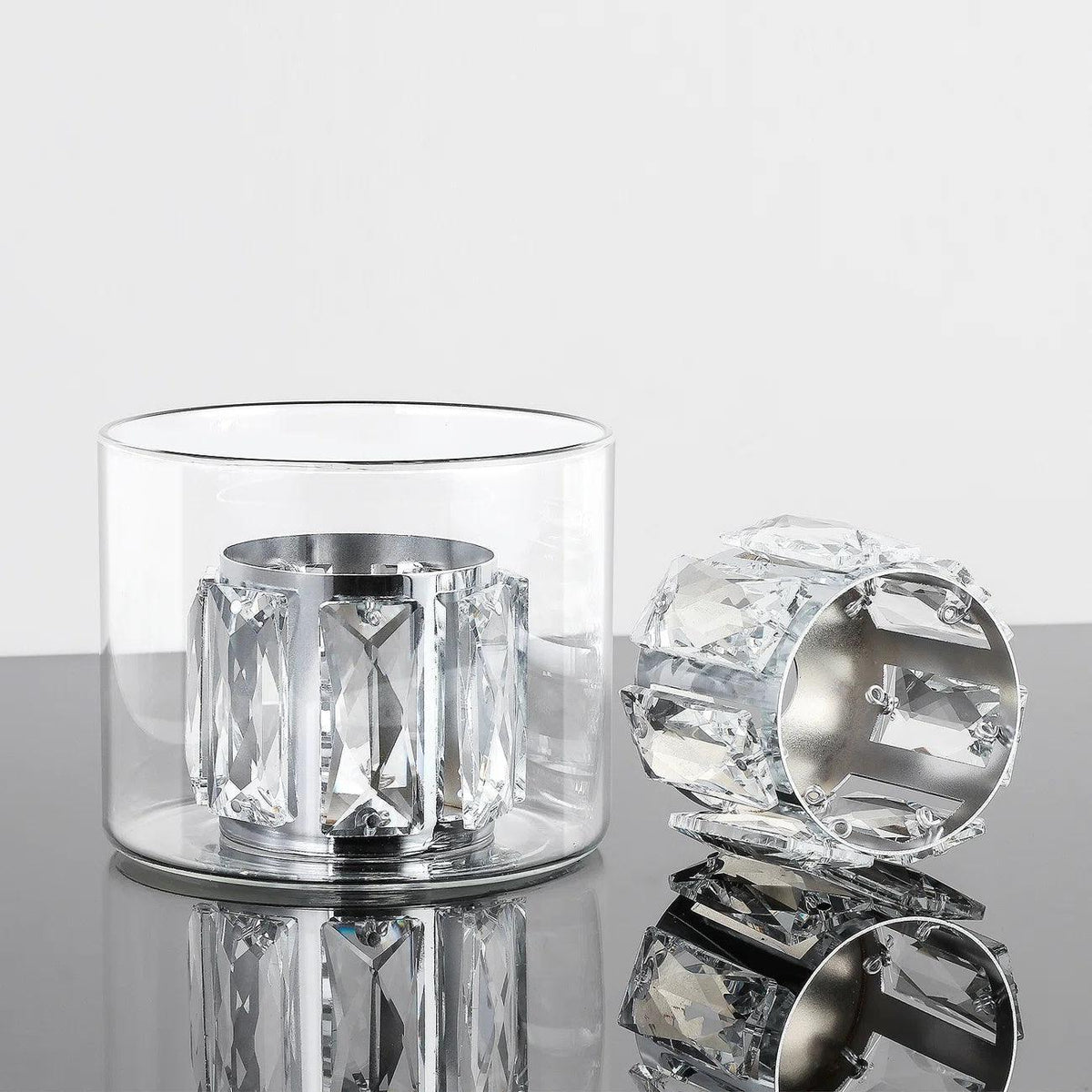 Close-up of clear crystal glass shade with faceted sides on a chrome base