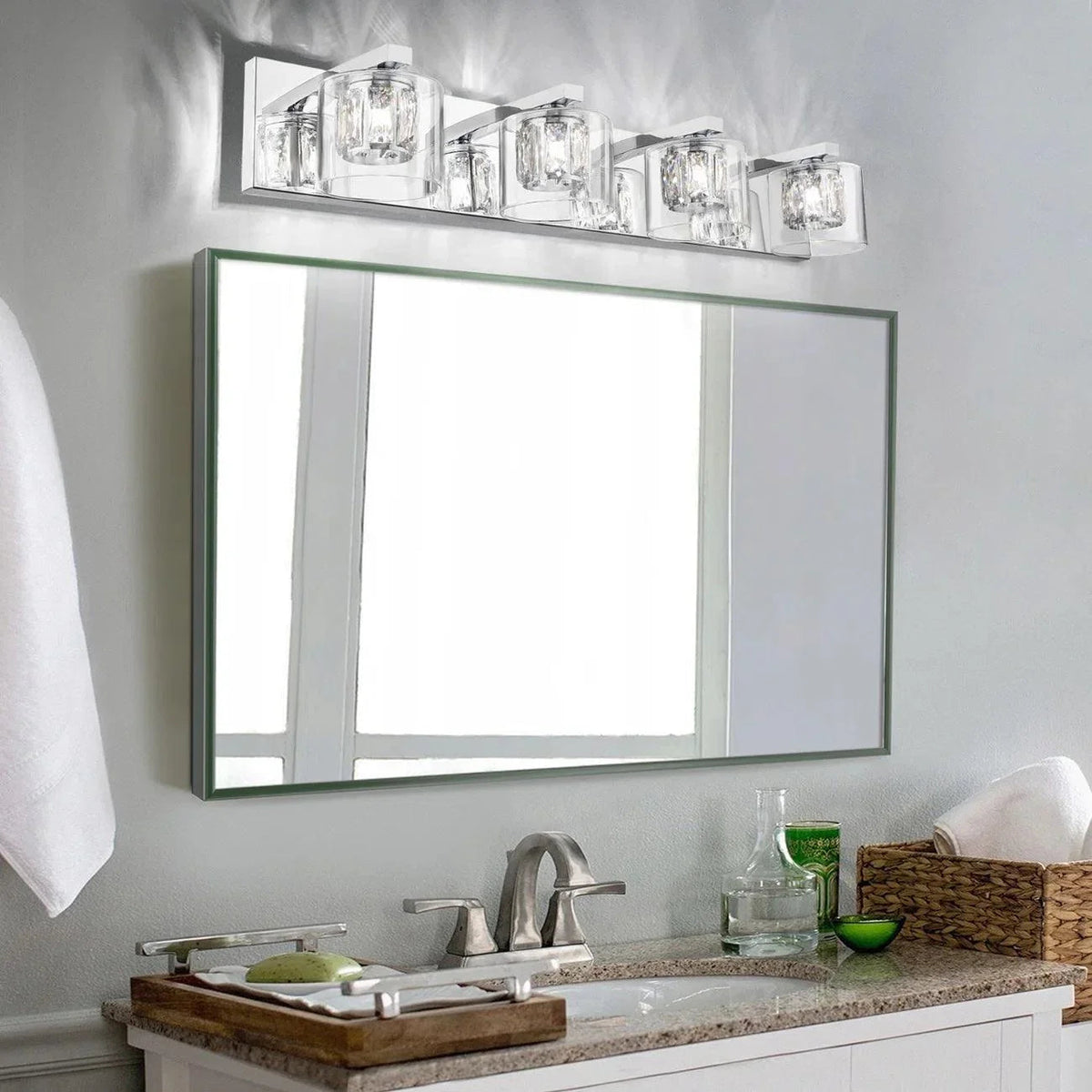 Chrome wall-mounted 4-light vanity light with clear glass cube shades