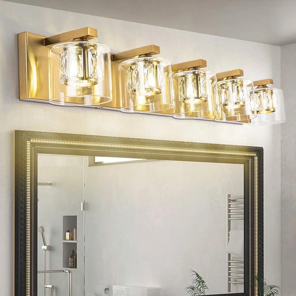 5-light bathroom vanity light with golden wall mount and clear glass cylinder shades