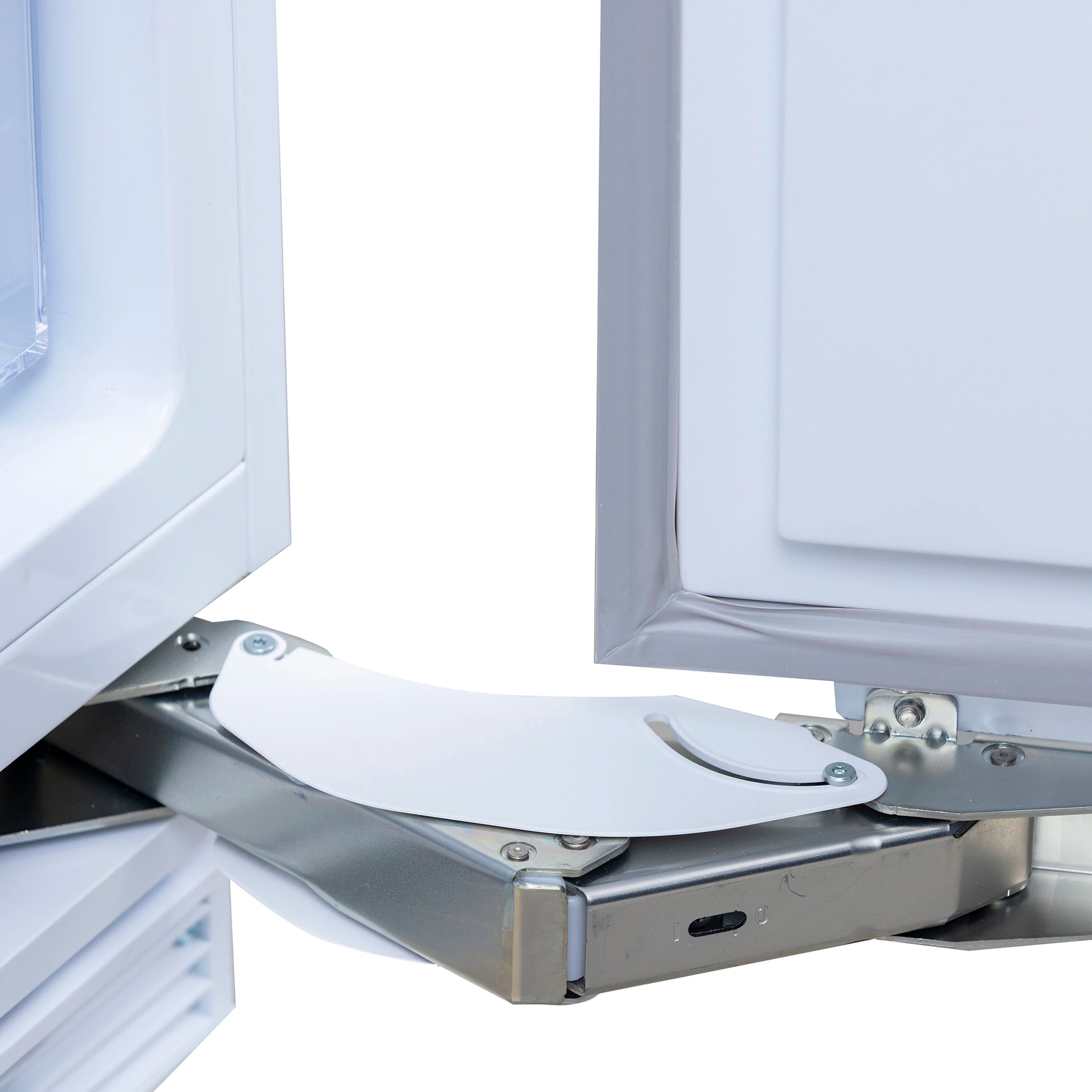Built-in refrigerator door open, showing hinge hardware and inner cabinet edge