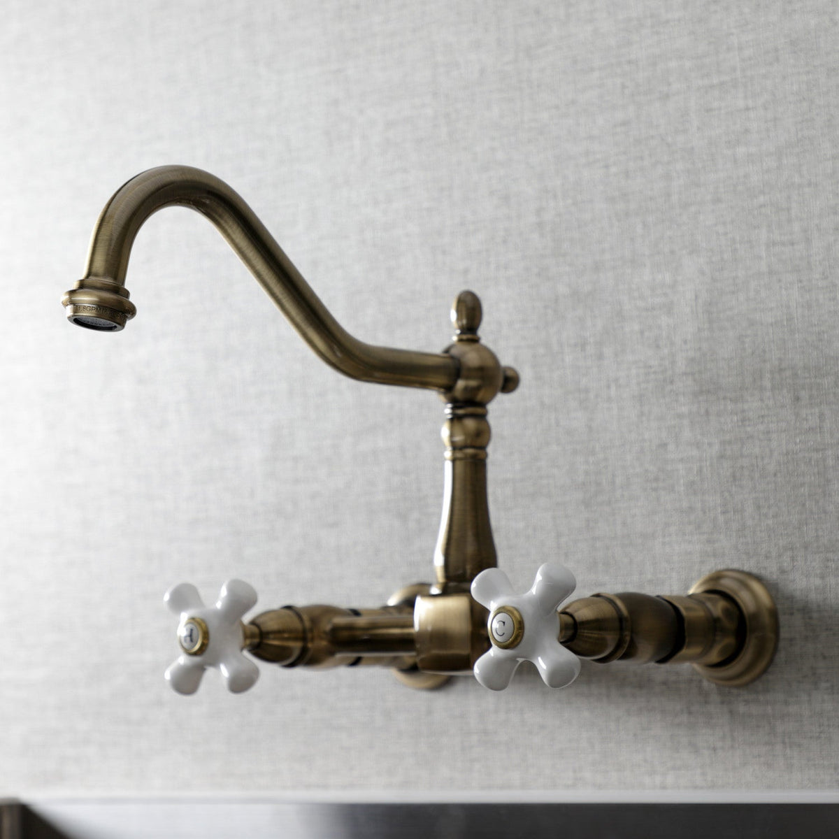 Heritage Double-Handle Wall-Mount Bridge Kitchen Faucet in Antique Brass