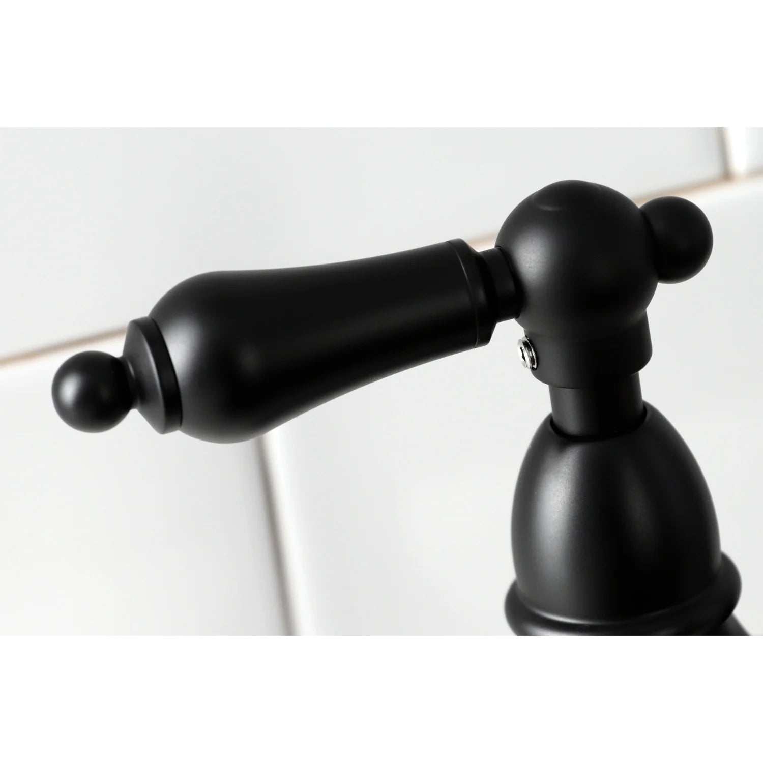 Matte black side sprayer arm and sprayer head close-up