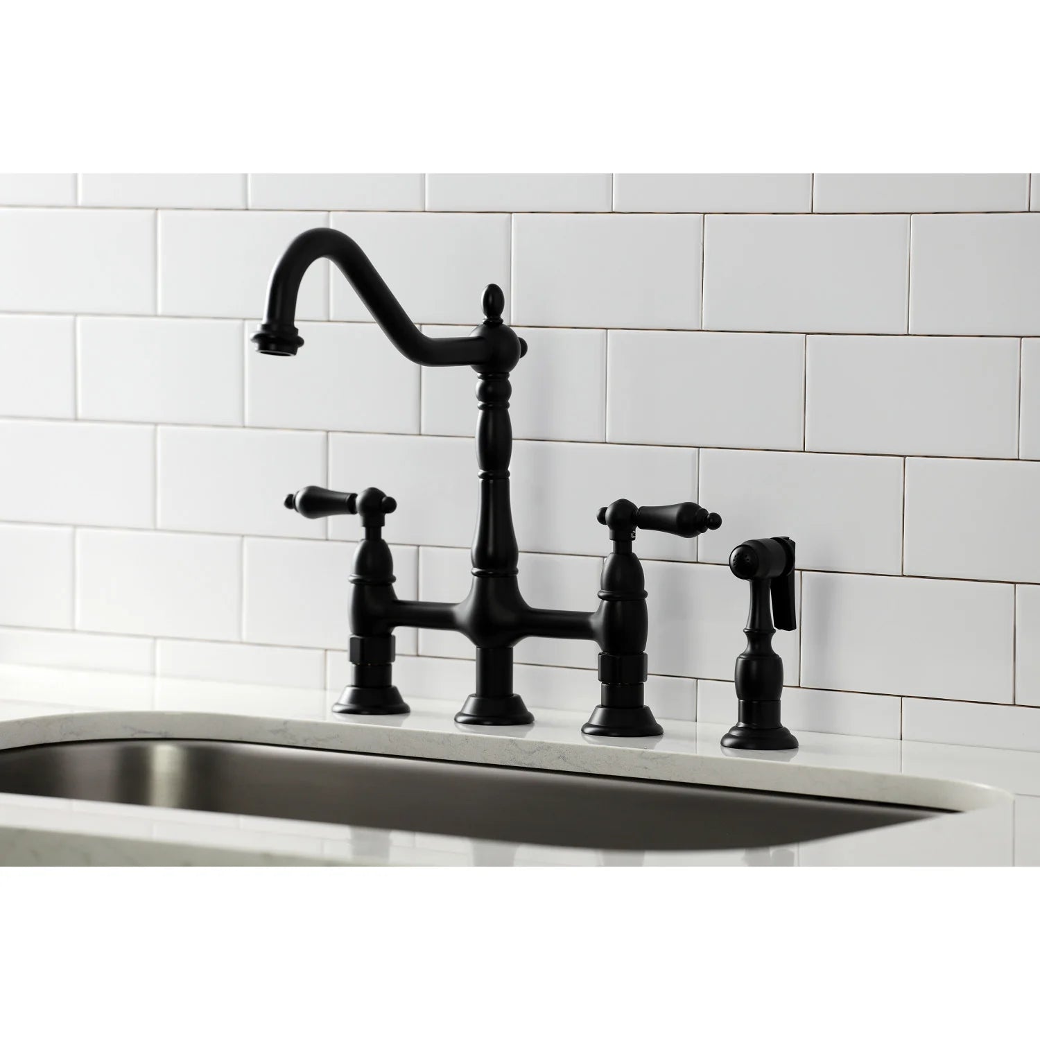 Matte black bridge kitchen faucet with arched spout, three handles, side sprayer
