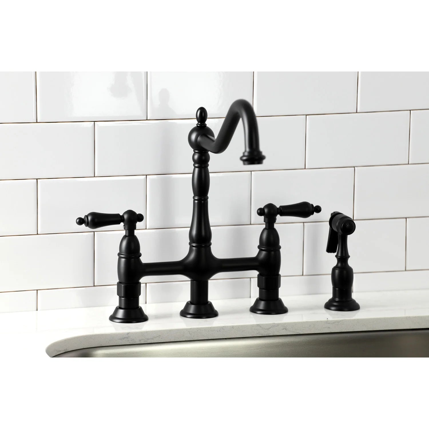 Matte black bridge kitchen faucet with three handles and side sprayer