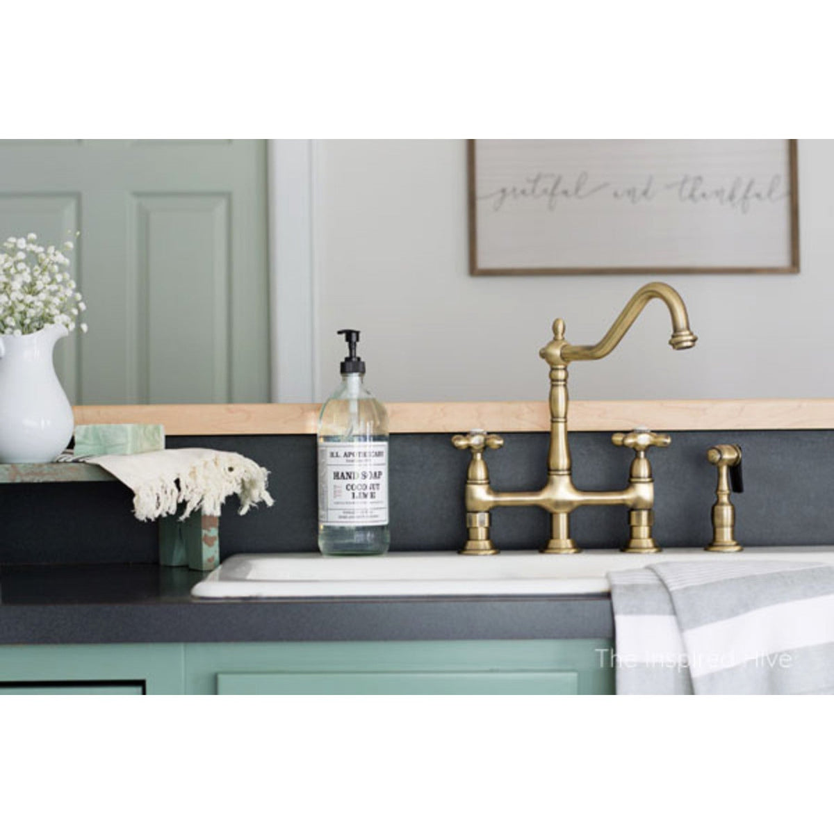 Heritage Bridge Kitchen Faucet with Brass Side Sprayer in Antique Brass