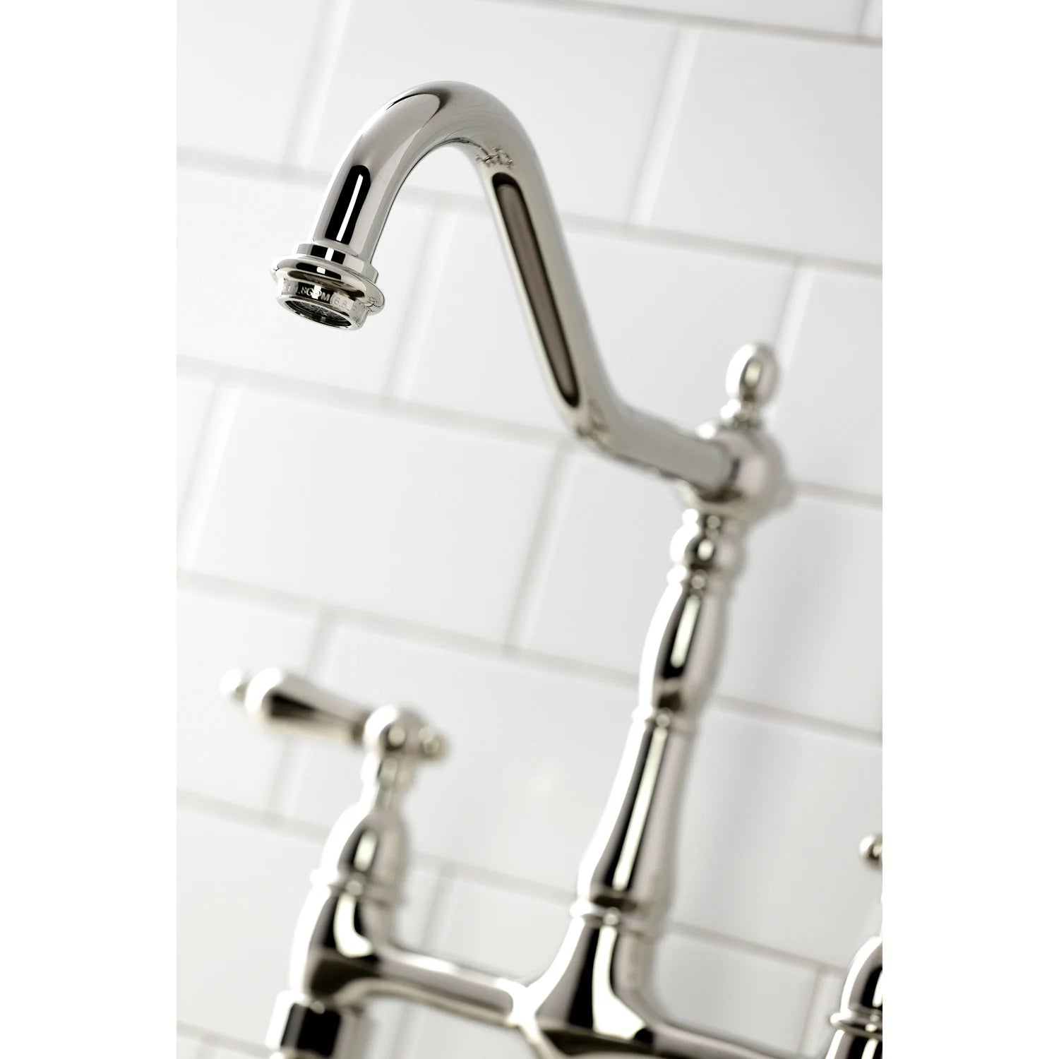 Polished nickel faucet spout with coordinating handles and side sprayer