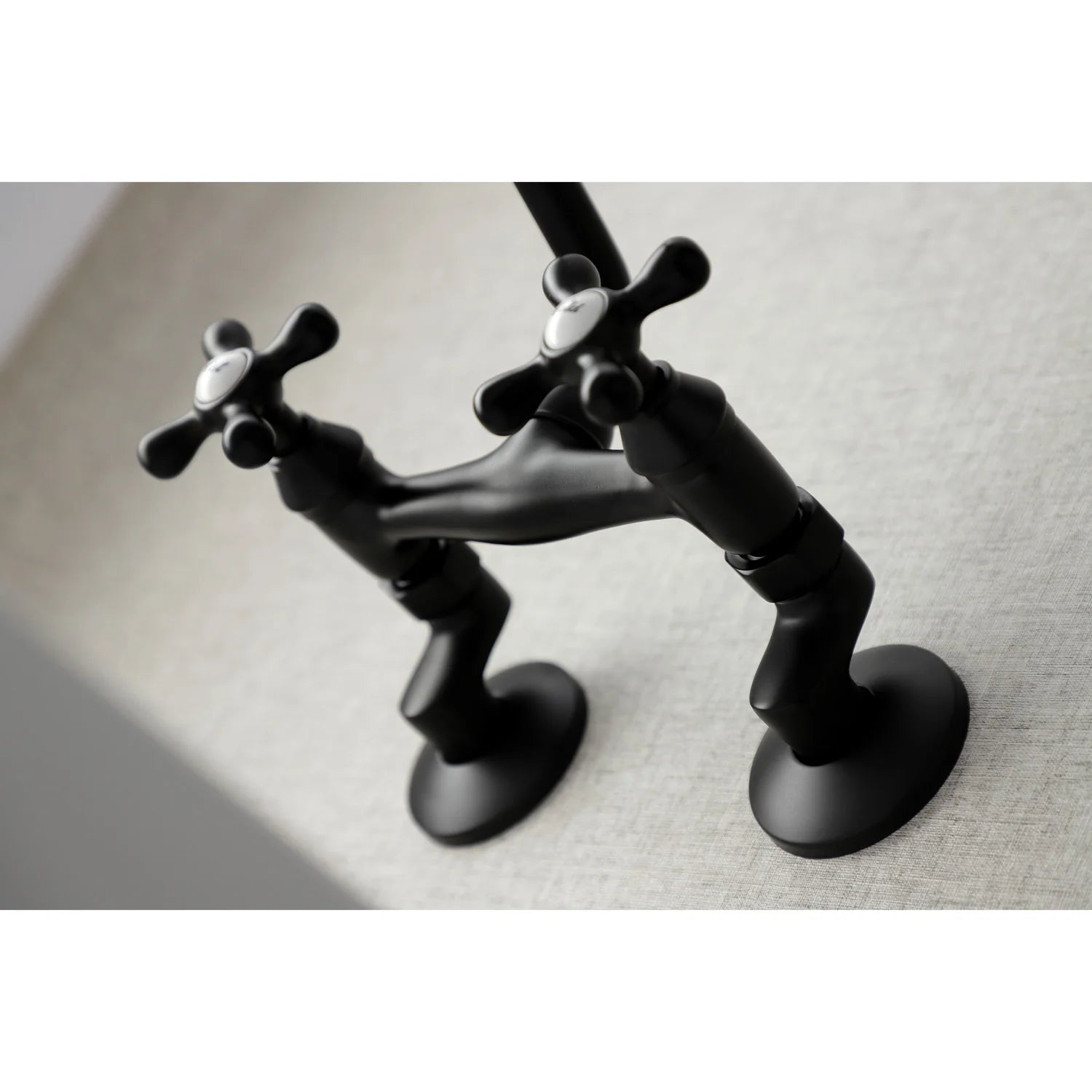 Matte black bridge wall-mount faucet with two cross handles and arched spout