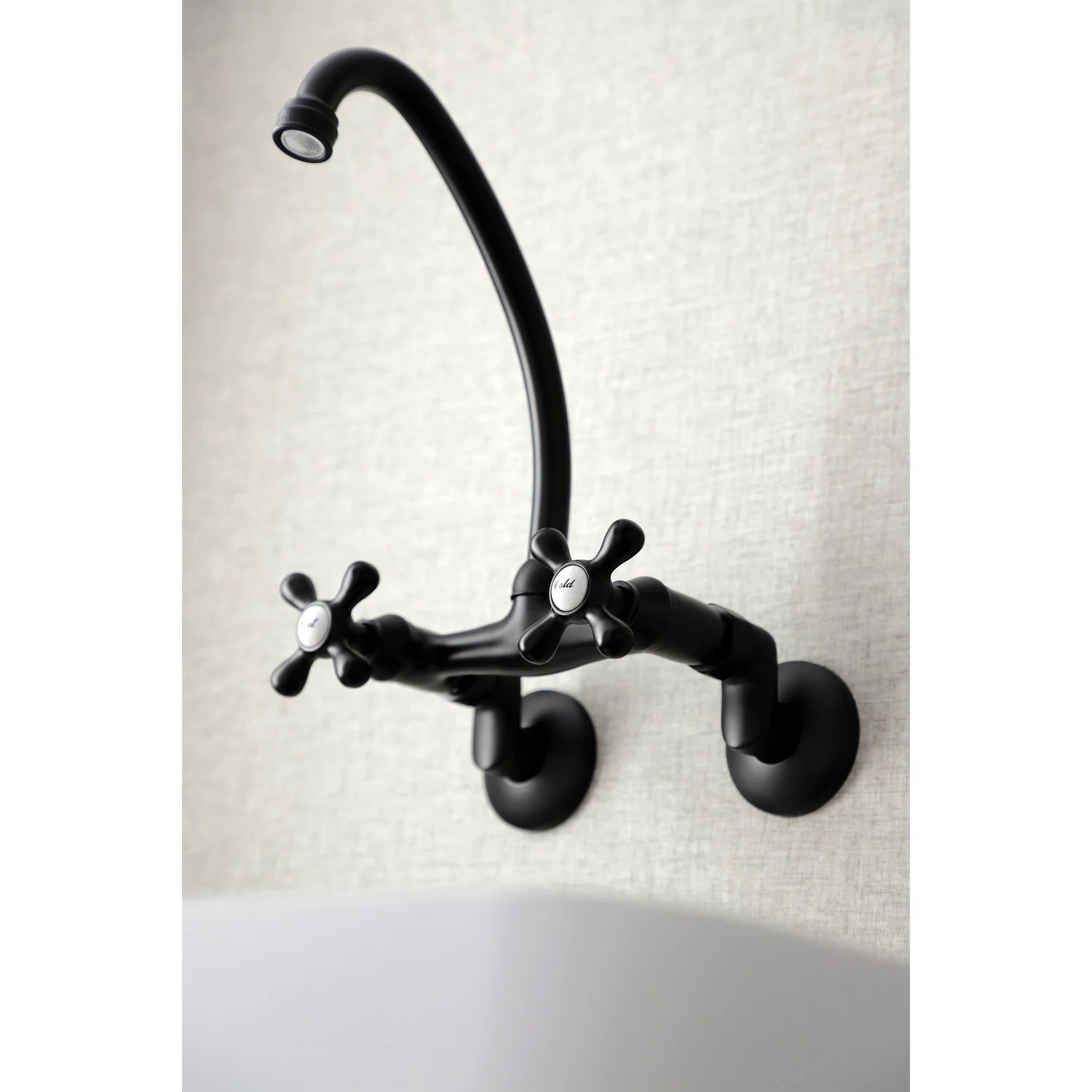 Matte black wall-mount kitchen faucet with curved gooseneck spout and twin handles