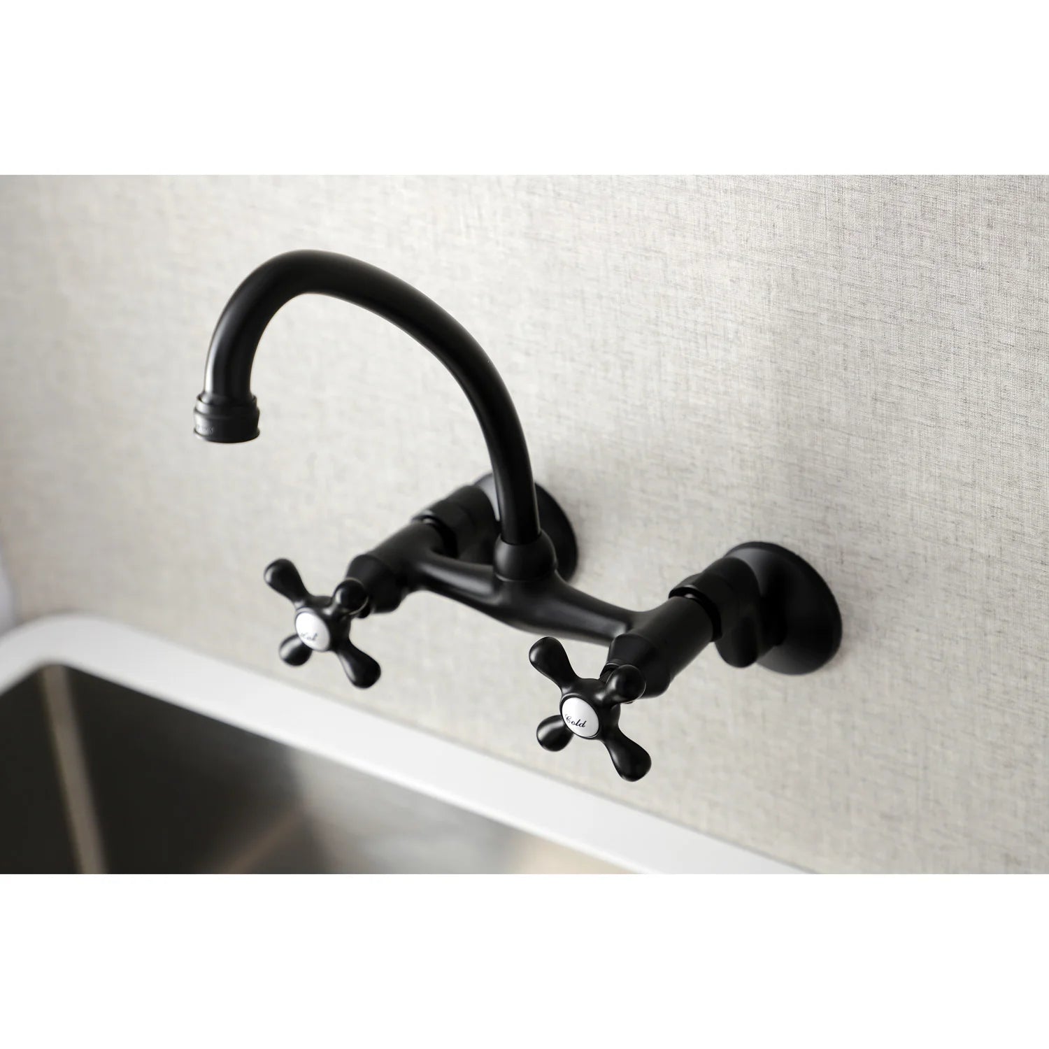 Matte black double-handle wall-mount bridge kitchen faucet on countertop backsplash
