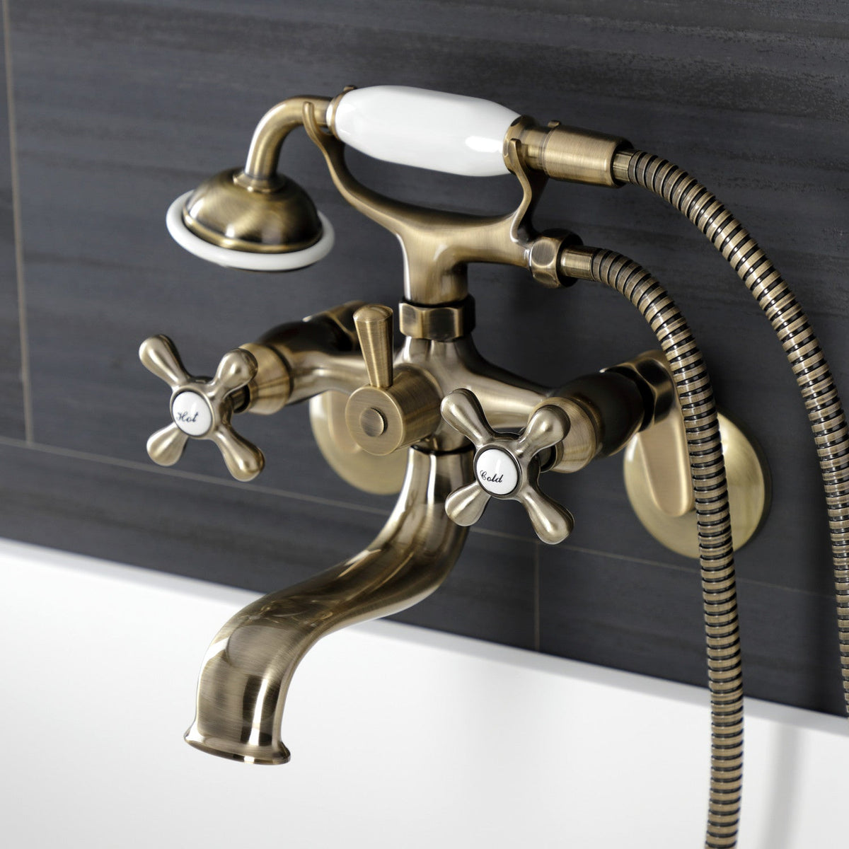 Kingston Wall Mount Tub Faucet with Hand Shower in Antique Brass