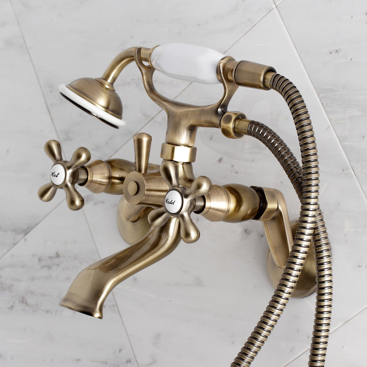 Kingston Wall Mount Clawfoot Tub Faucet with Hand Shower in Antique Brass