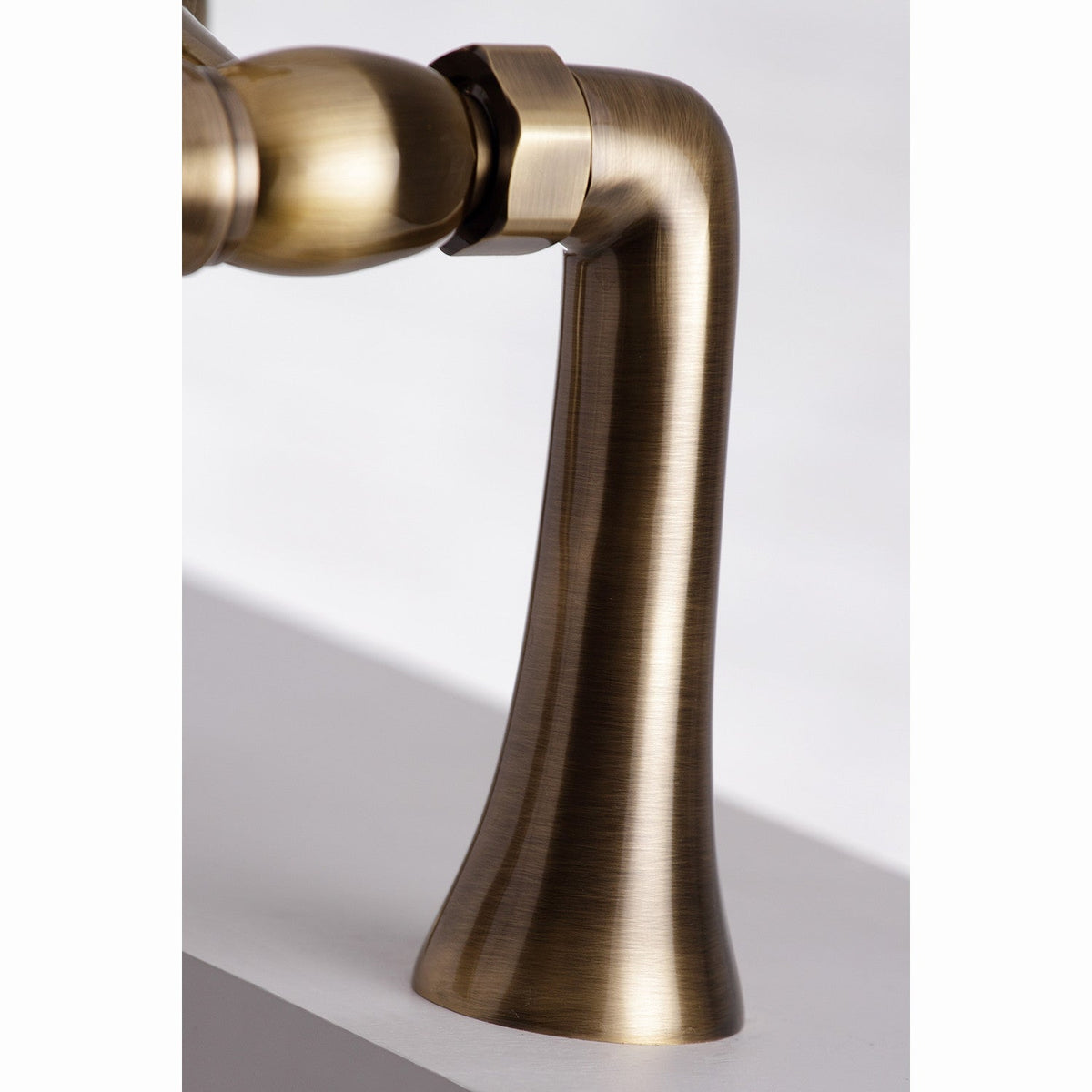 Essex 7" Center Deck-Mount Clawfoot Tub Faucet with Hand Shower in Antique Brass