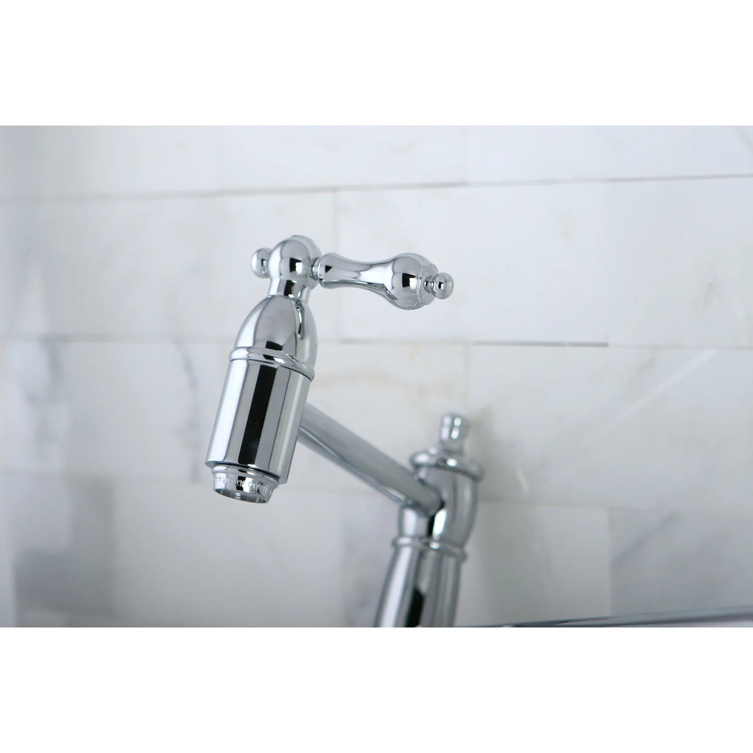 Polished chrome pot filler faucet close-up of top valve and arm