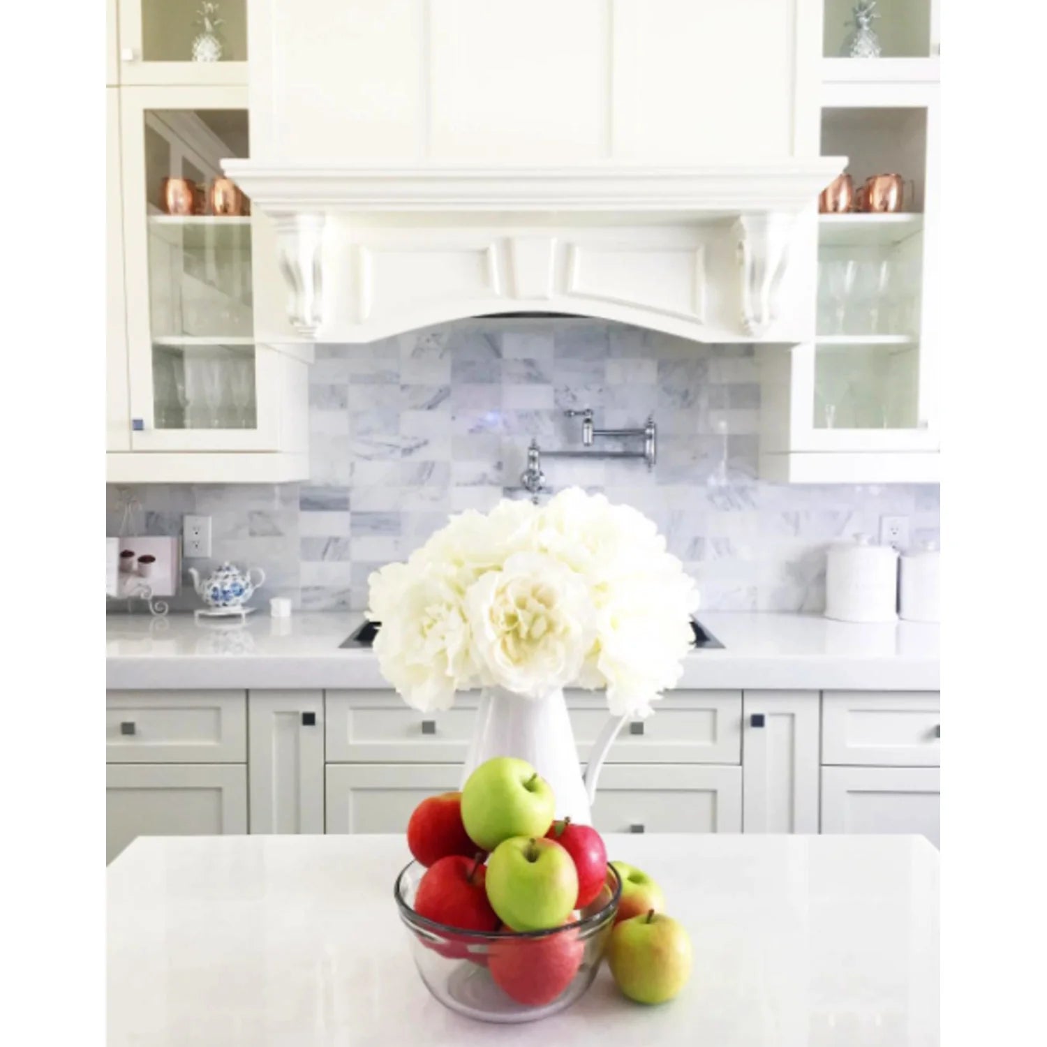 Polished chrome wall-mounted pot filler faucet with two matching controls
