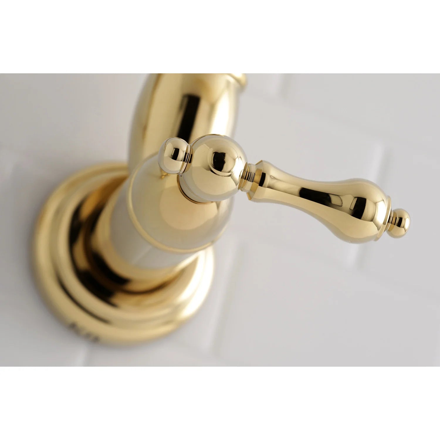 Polished brass pot filler faucet head with round wall base and angled spout