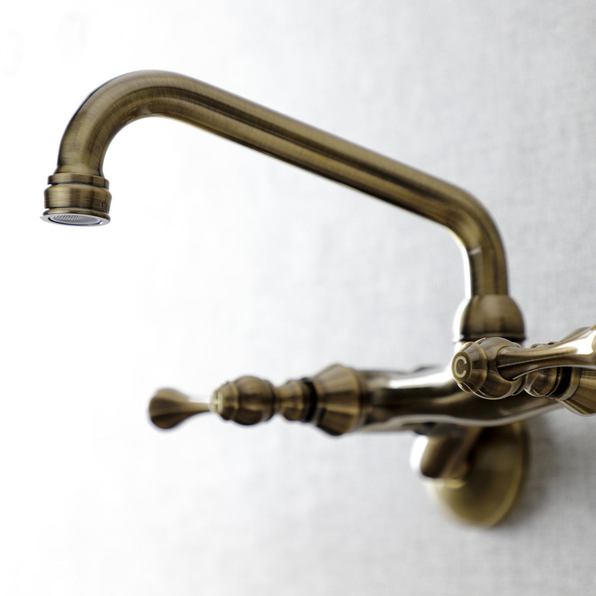 Kingston Double-Handle Wall-Mount Bridge Kitchen Faucet in Antique Brass