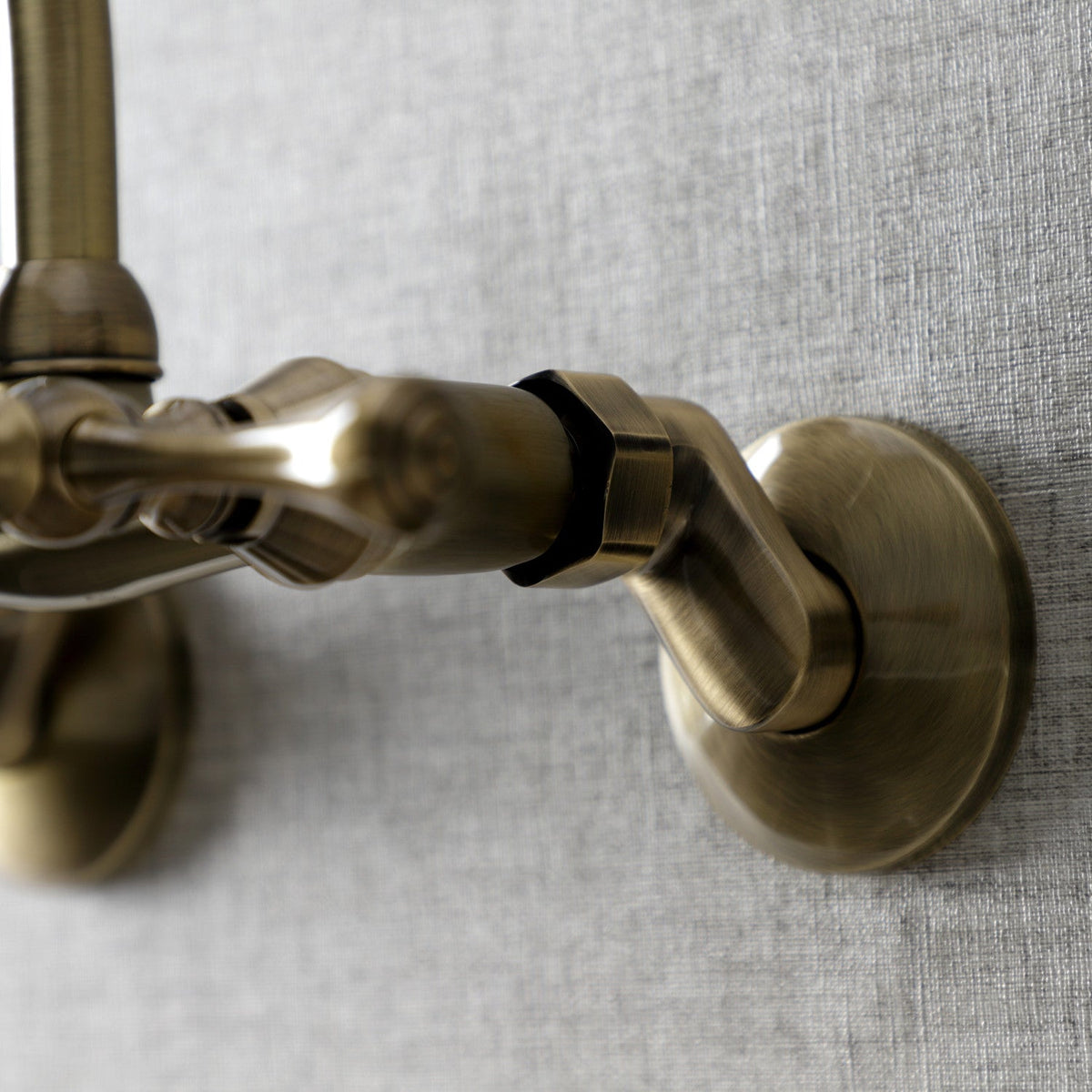 Kingston Double-Handle Wall-Mount Bridge Kitchen Faucet in Antique Brass