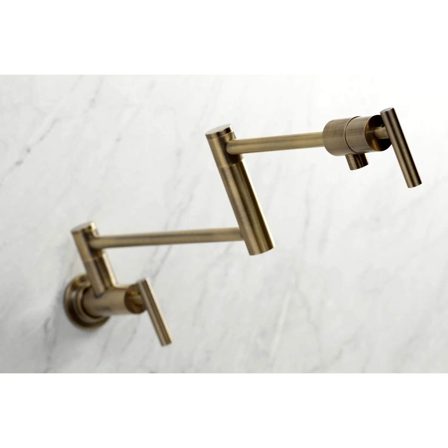 Wall mount pot filler faucet in antique brass with two wall arms and angled spout