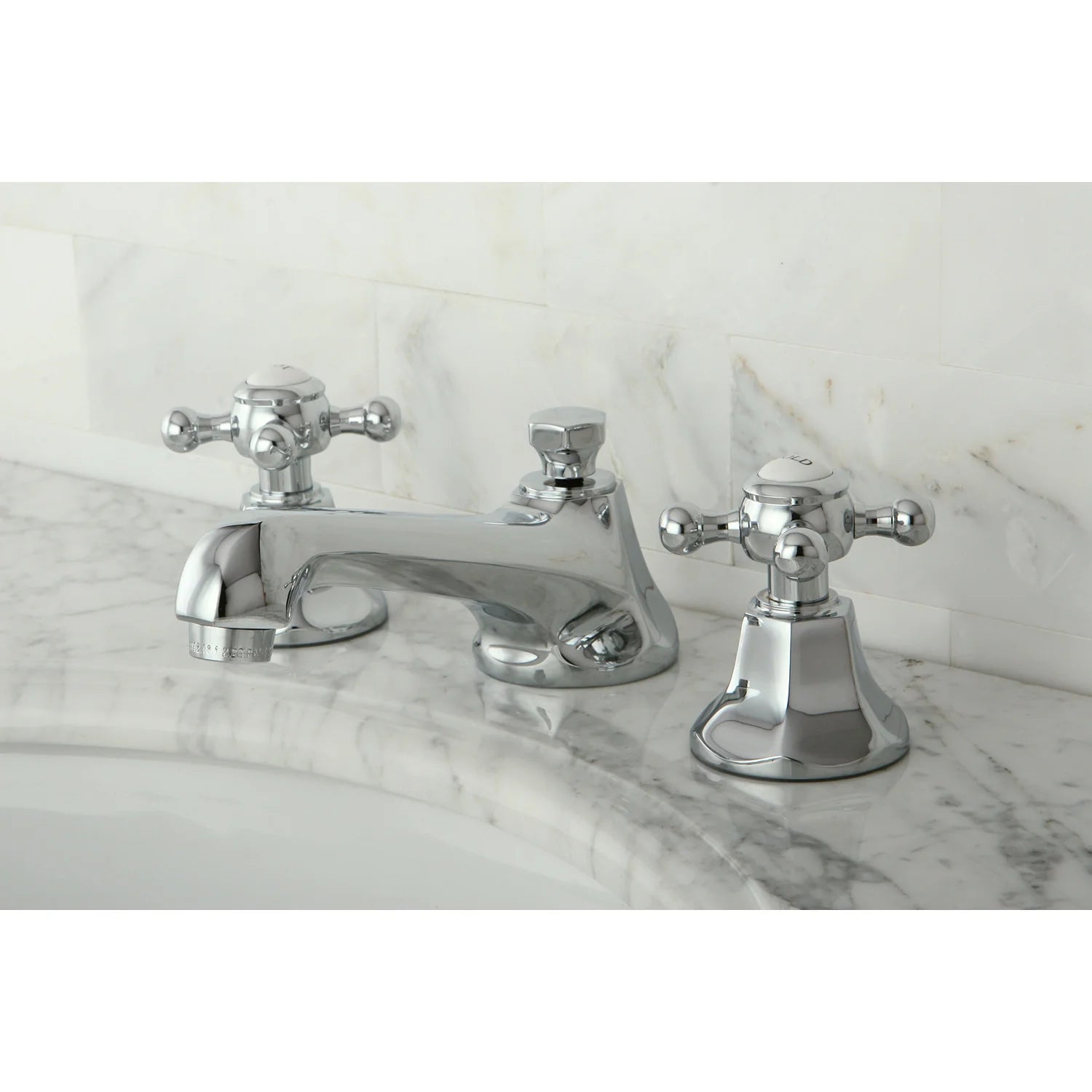 Polished chrome widespread bathroom faucet set with spout, two handles, and pop-up