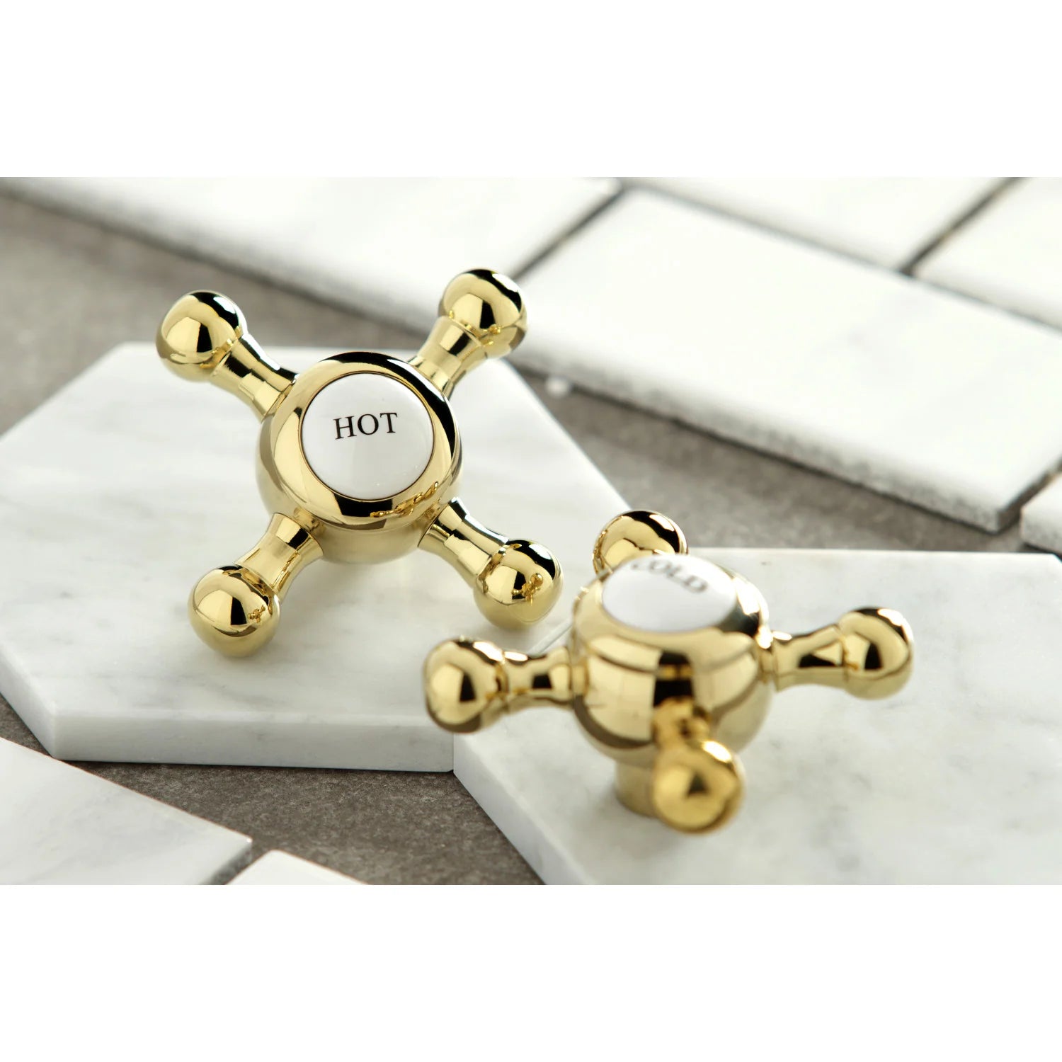Polished brass widespread faucet handles with HOT and cold knob markings