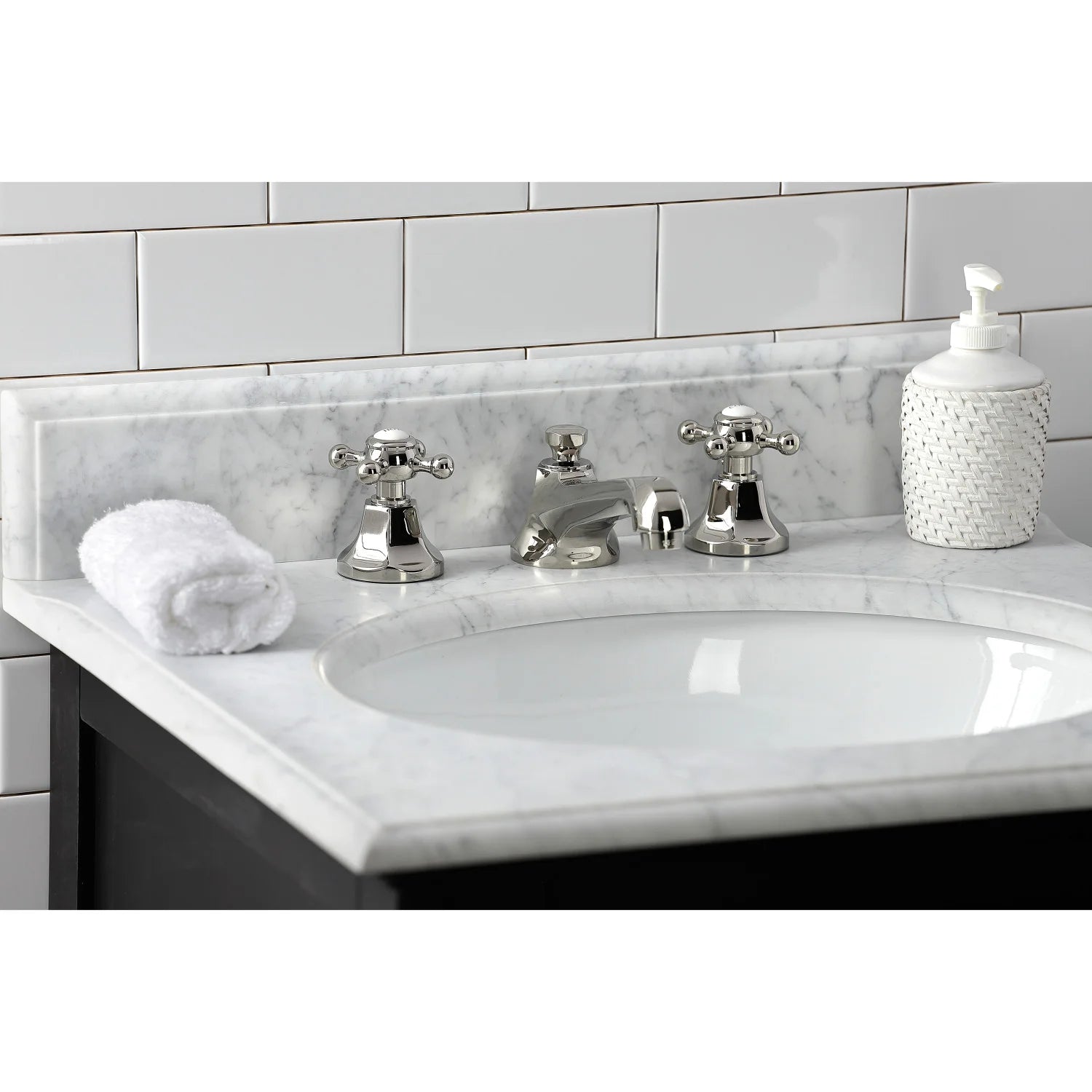 Polished nickel widespread bathroom faucet with three-piece cross-handle layout