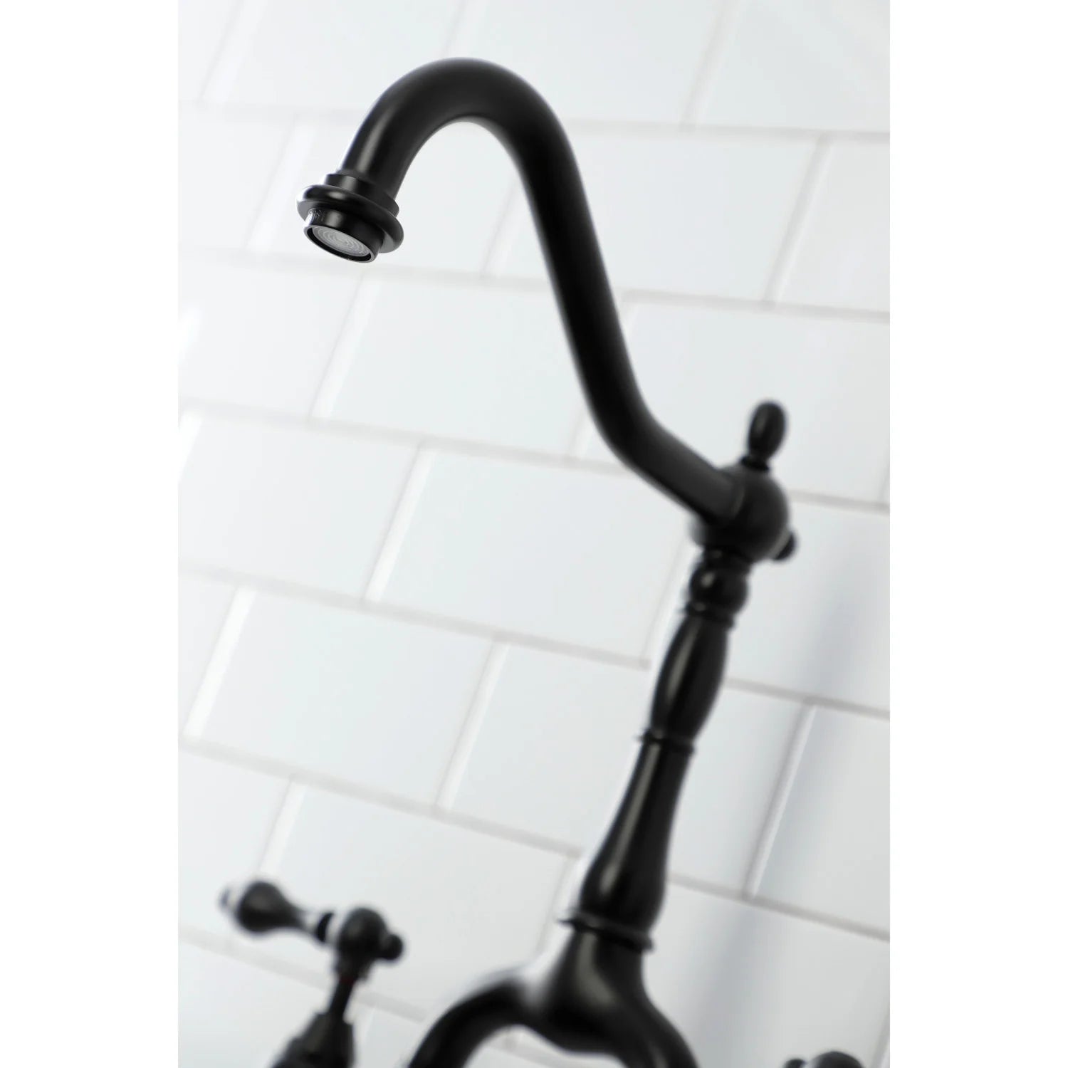 Matte black curved spout bridge faucet with deck-mounted handle