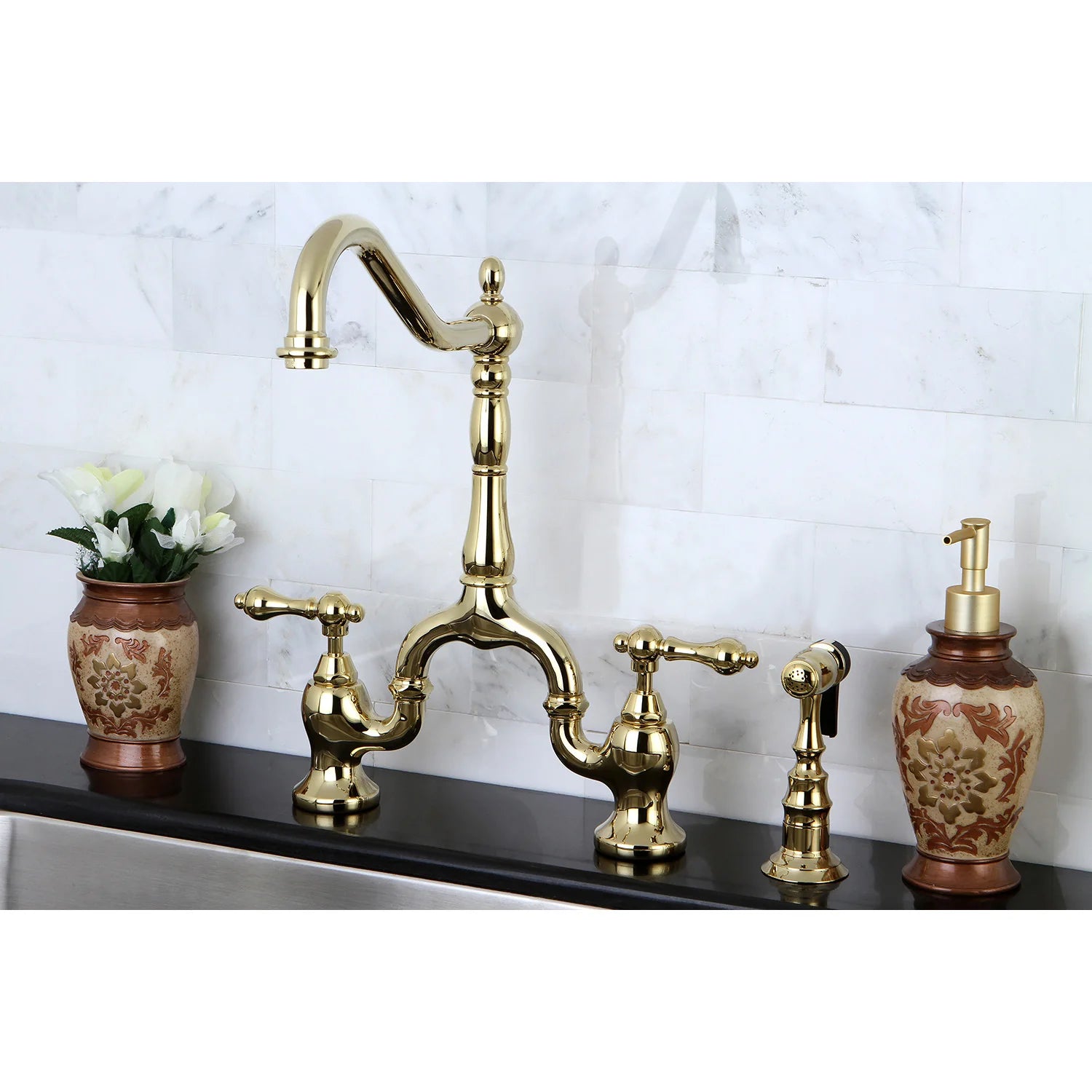 Polished brass bridge kitchen faucet with cross handles and side sprayer