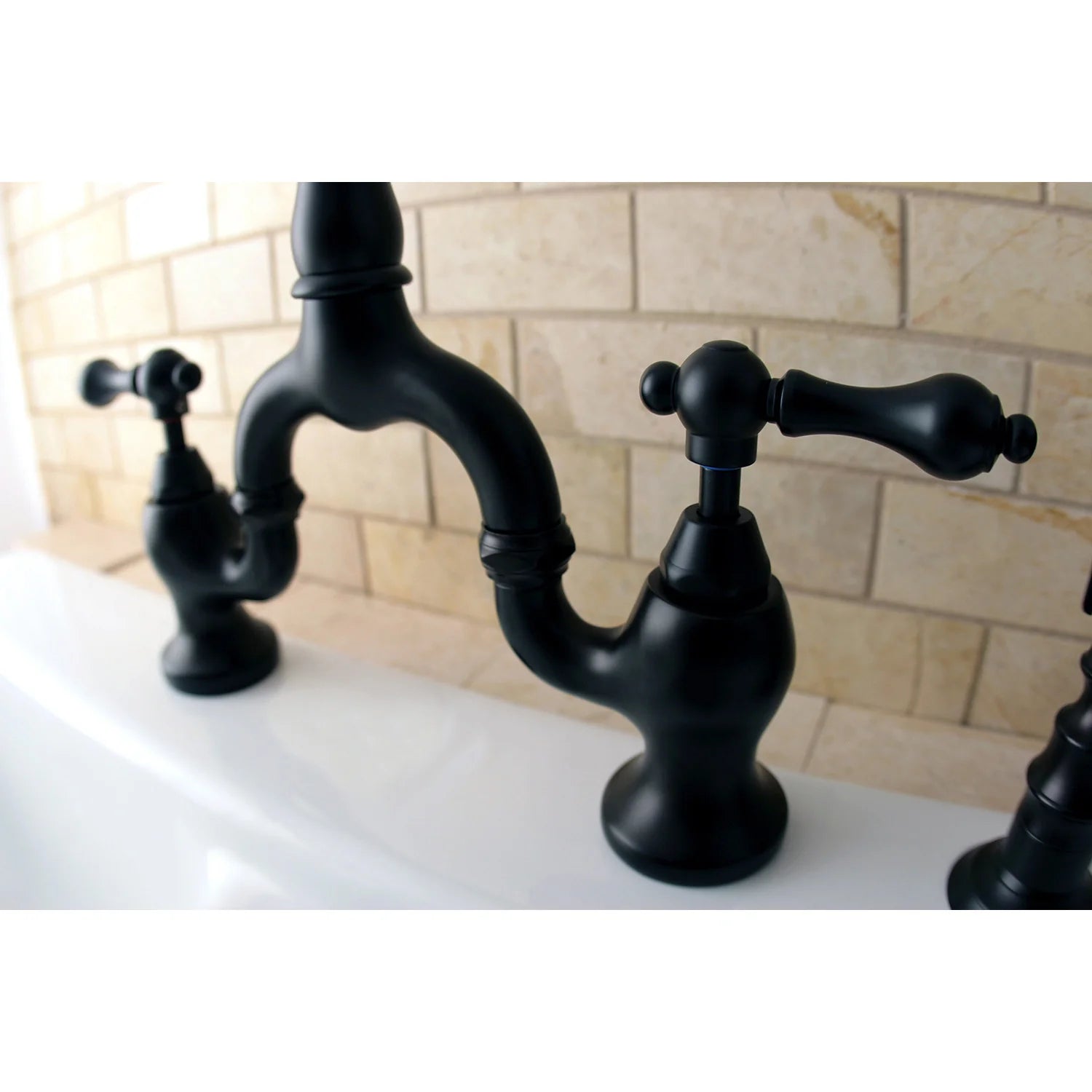 Oil-rubbed bronze bridge kitchen faucet with curved spout and side sprayer