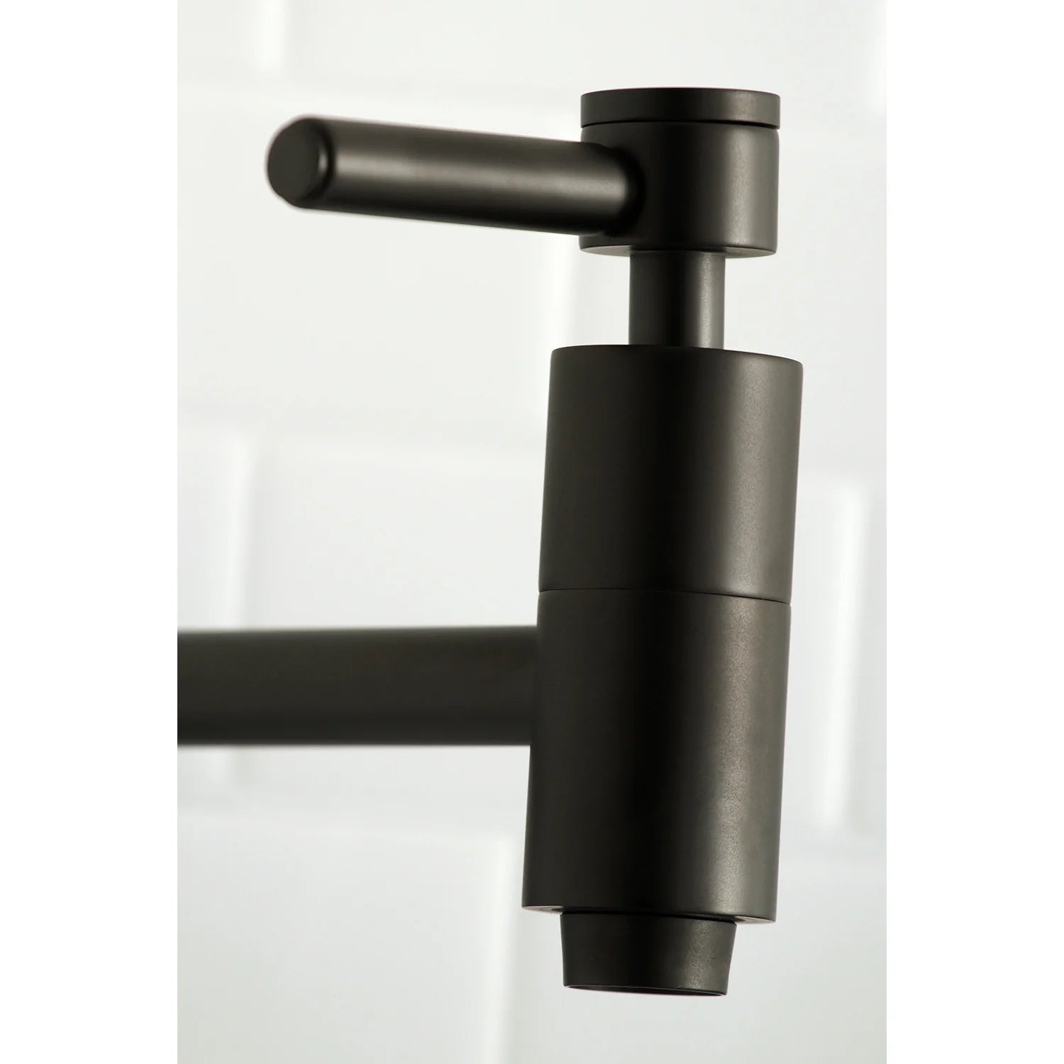 Matte black wall mount pot filler faucet body with side lever handle and spout