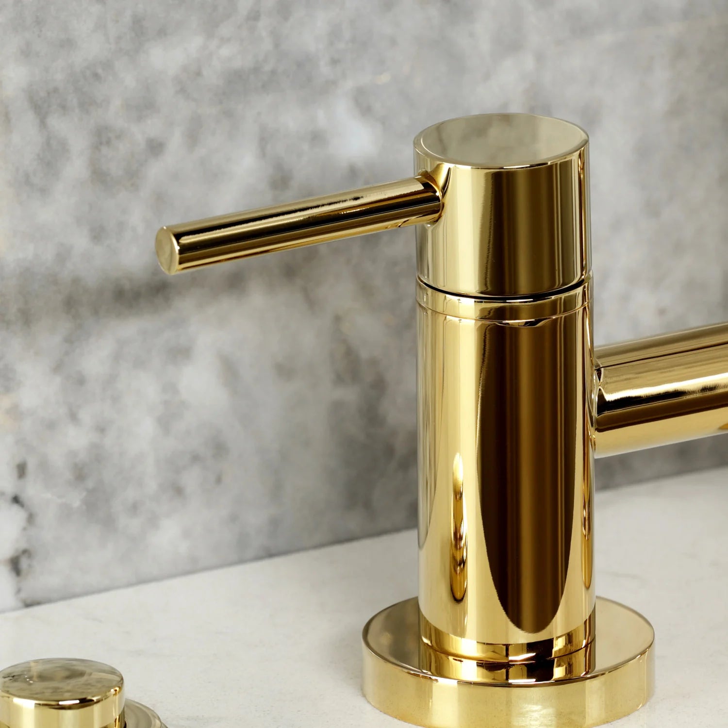 Polished brass faucet with tall cylindrical body and long lever handle