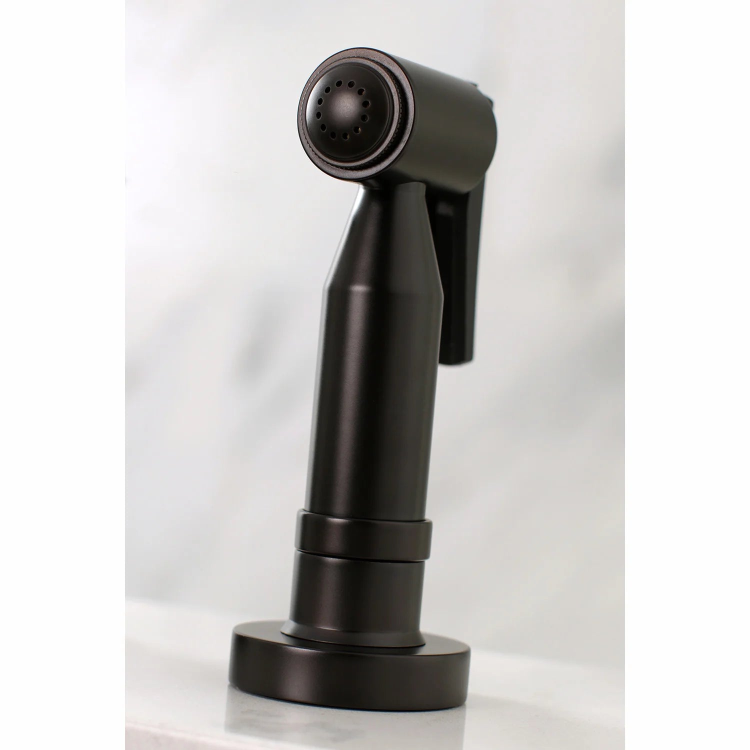 Oil-rubbed bronze side sprayer with round showerhead spray face