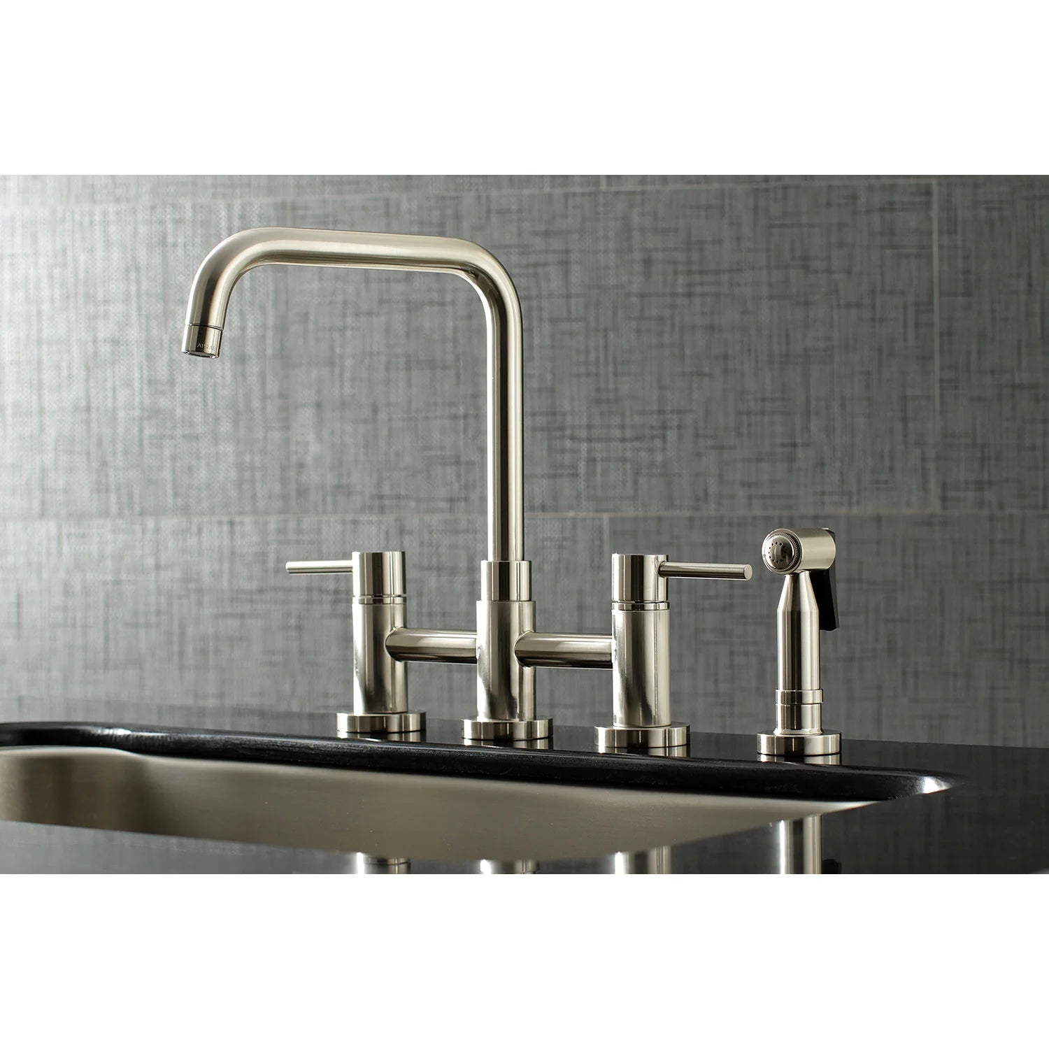 Brushed nickel deck-mount kitchen faucet with curved spout and side sprayer