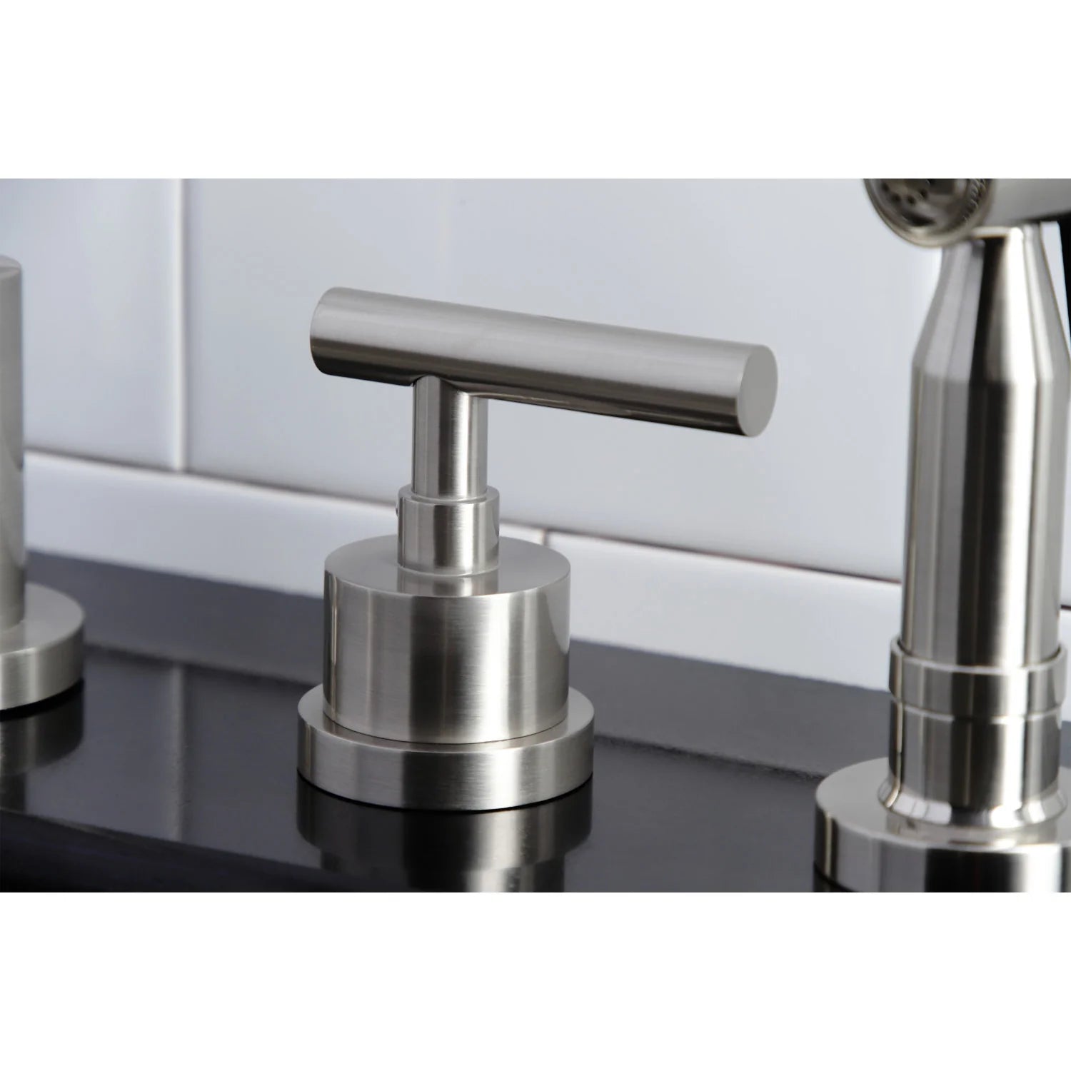 Brushed nickel lever handle with round base on widespread kitchen faucet