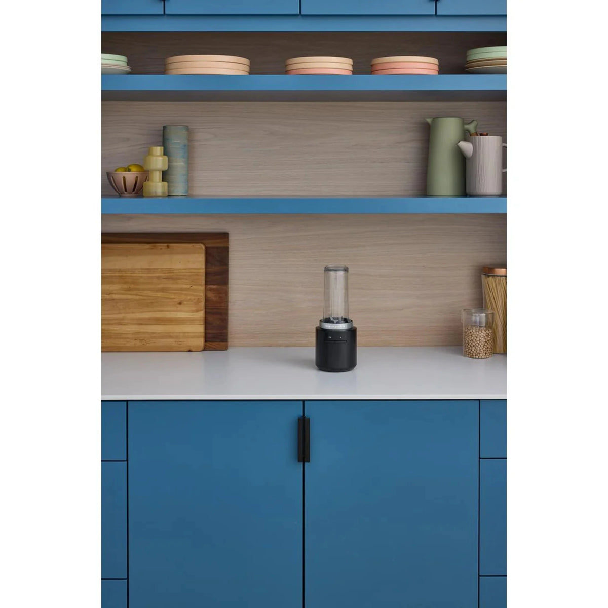 KitchenAid cordless personal blender placed in a kitchen cabinet niche