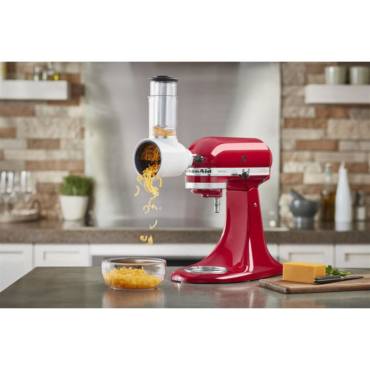 KitchenAid Fresh Prep slicer/shredder attachment on red stand mixer dispensing shredded food
