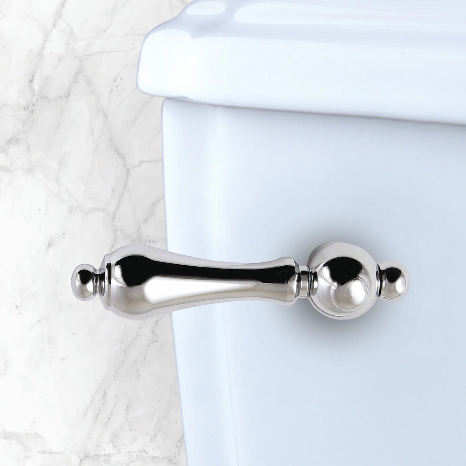 Polished chrome toilet tank lever with round handle mounted on tank