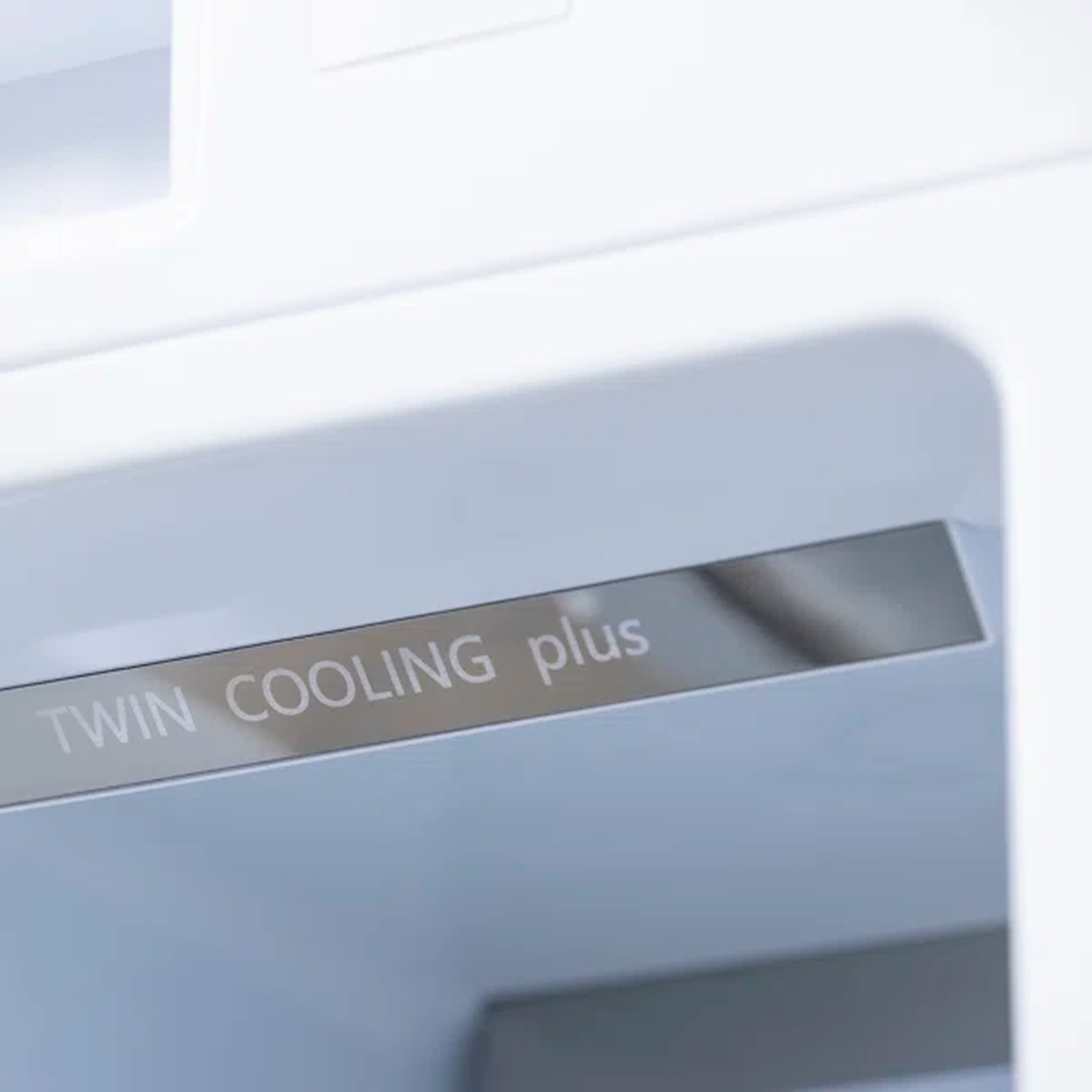 Freezer air system label reading 'TWIN COOLING plus' on interior panel