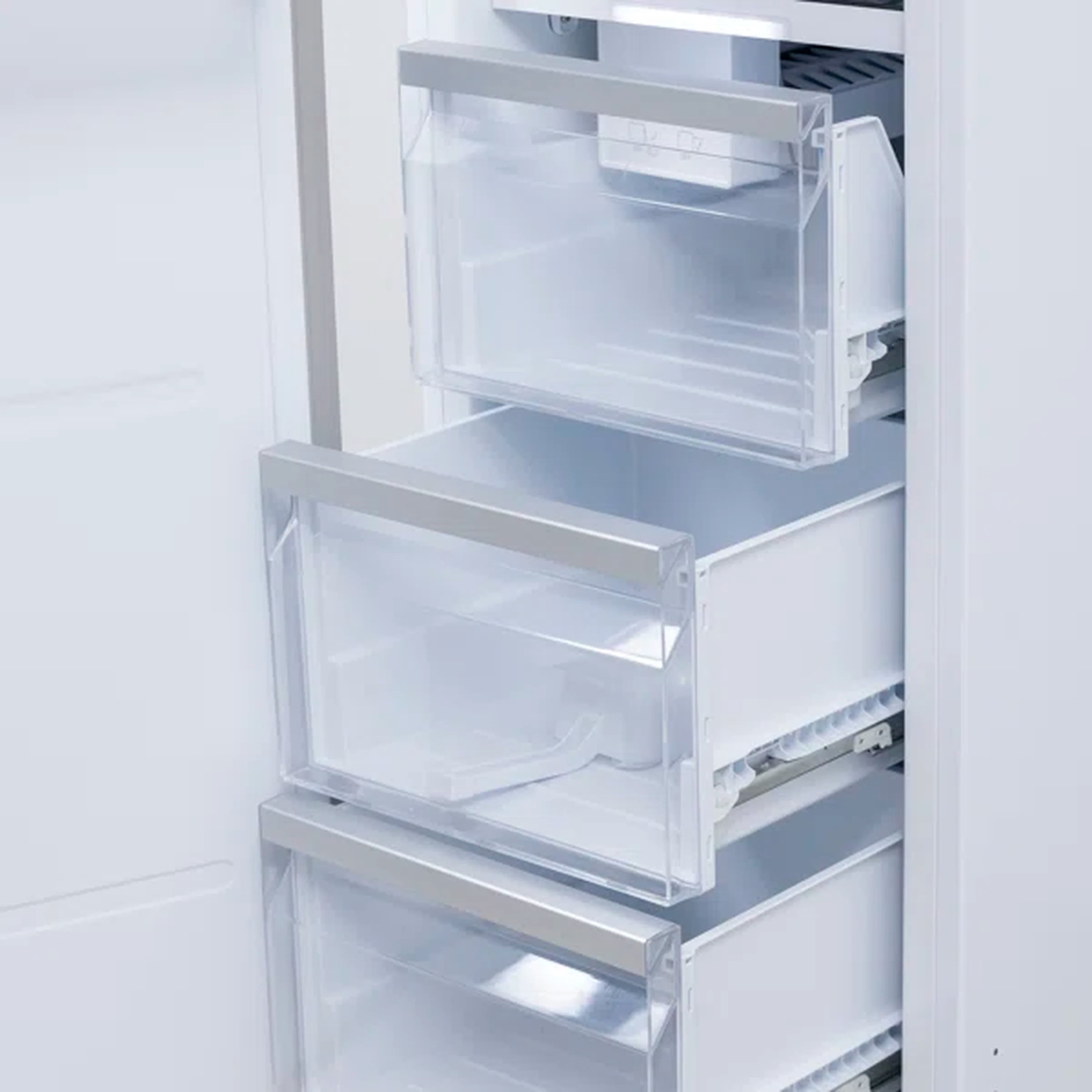 Counter-depth freezer with door open, stacked shelves and clear bins visible