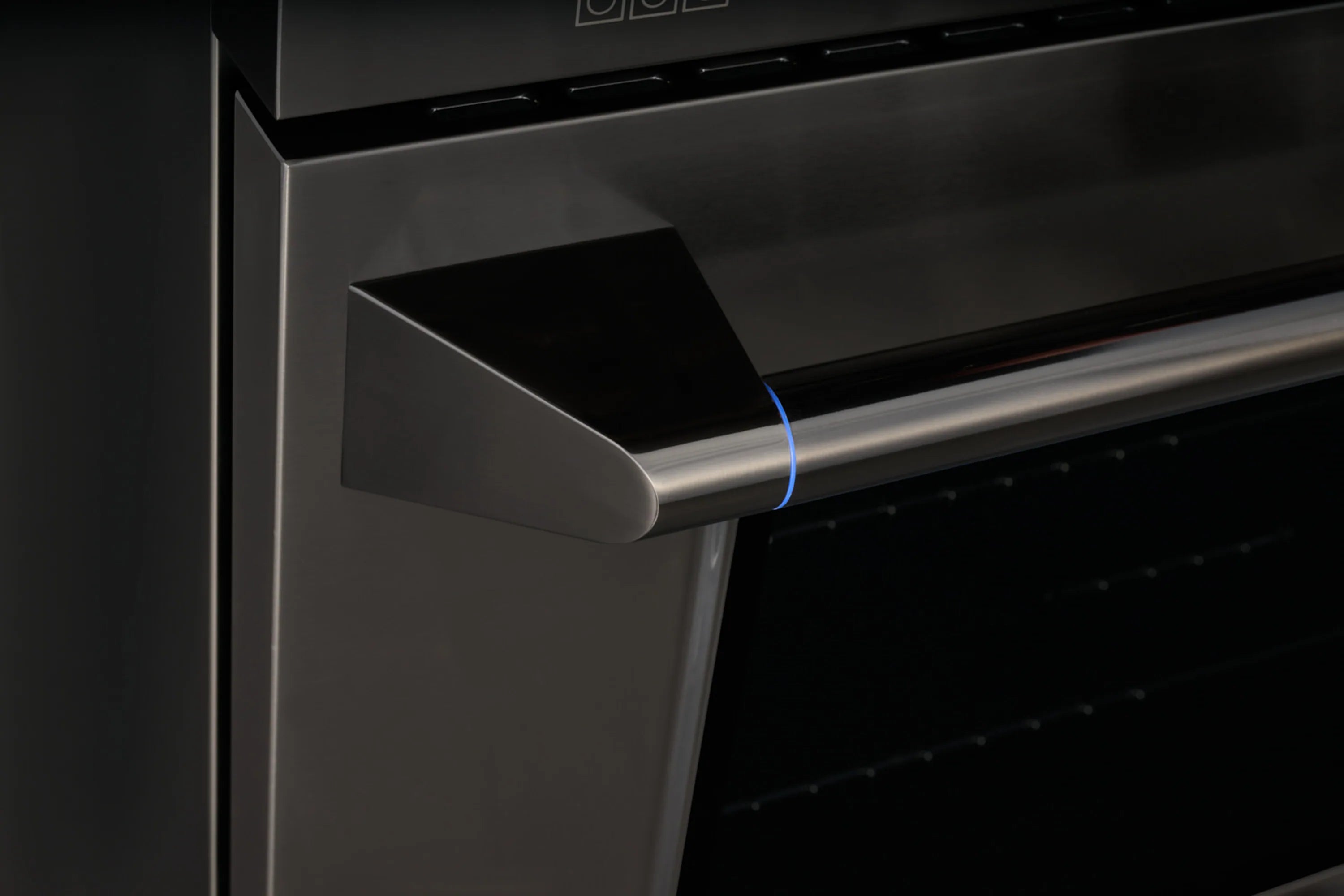 Freestanding dual-fuel range handle on titanium stainless steel oven door