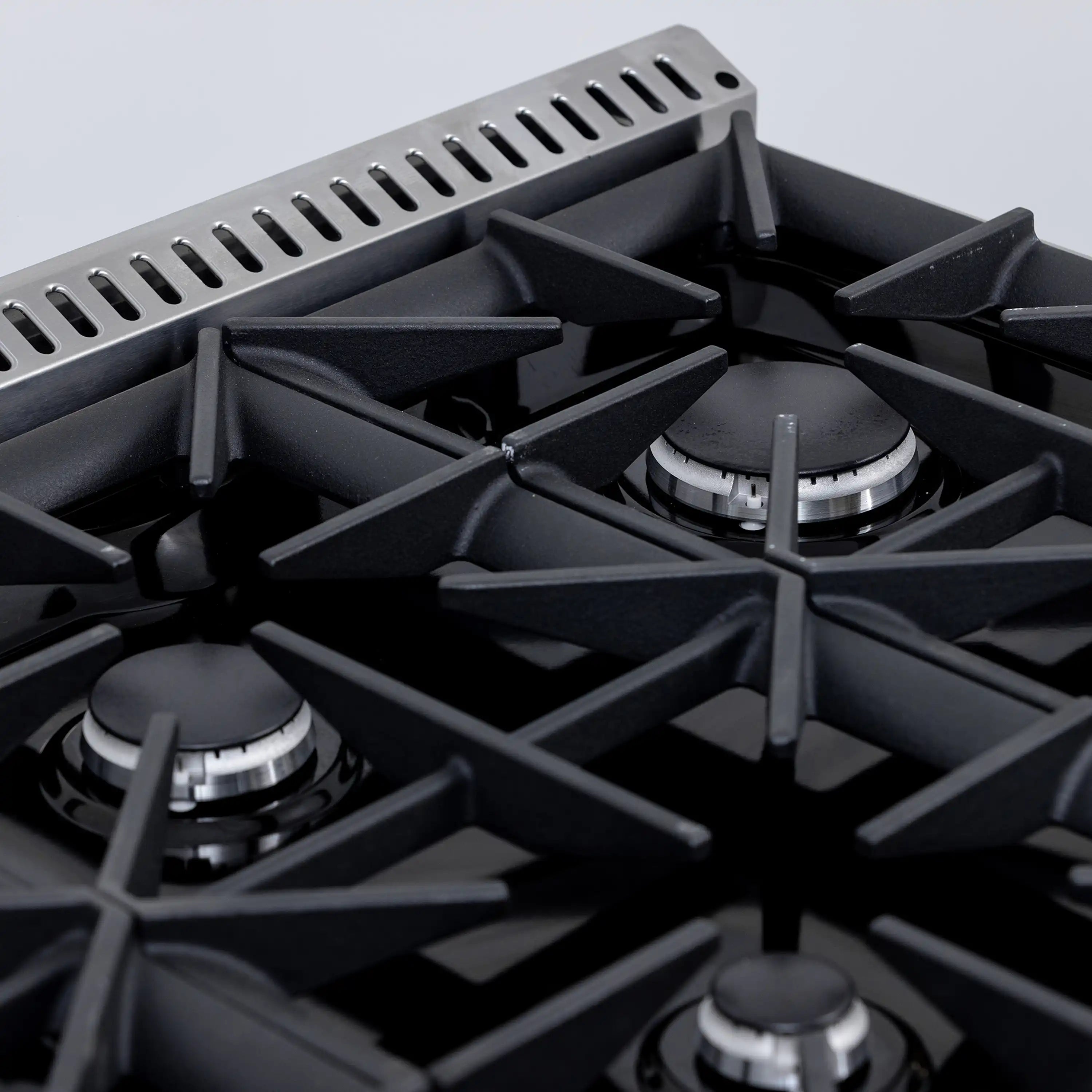 Black gas burner grates with cast burner heads and metal support bars
