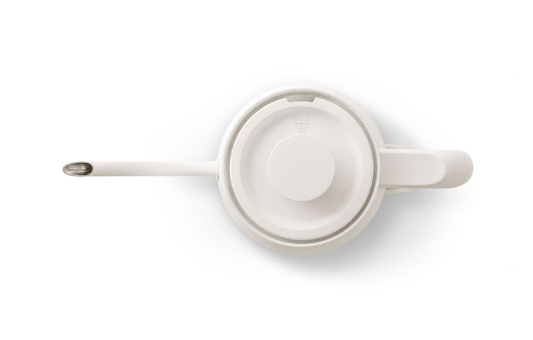 White kettle base view with circular center cap and spout arm.